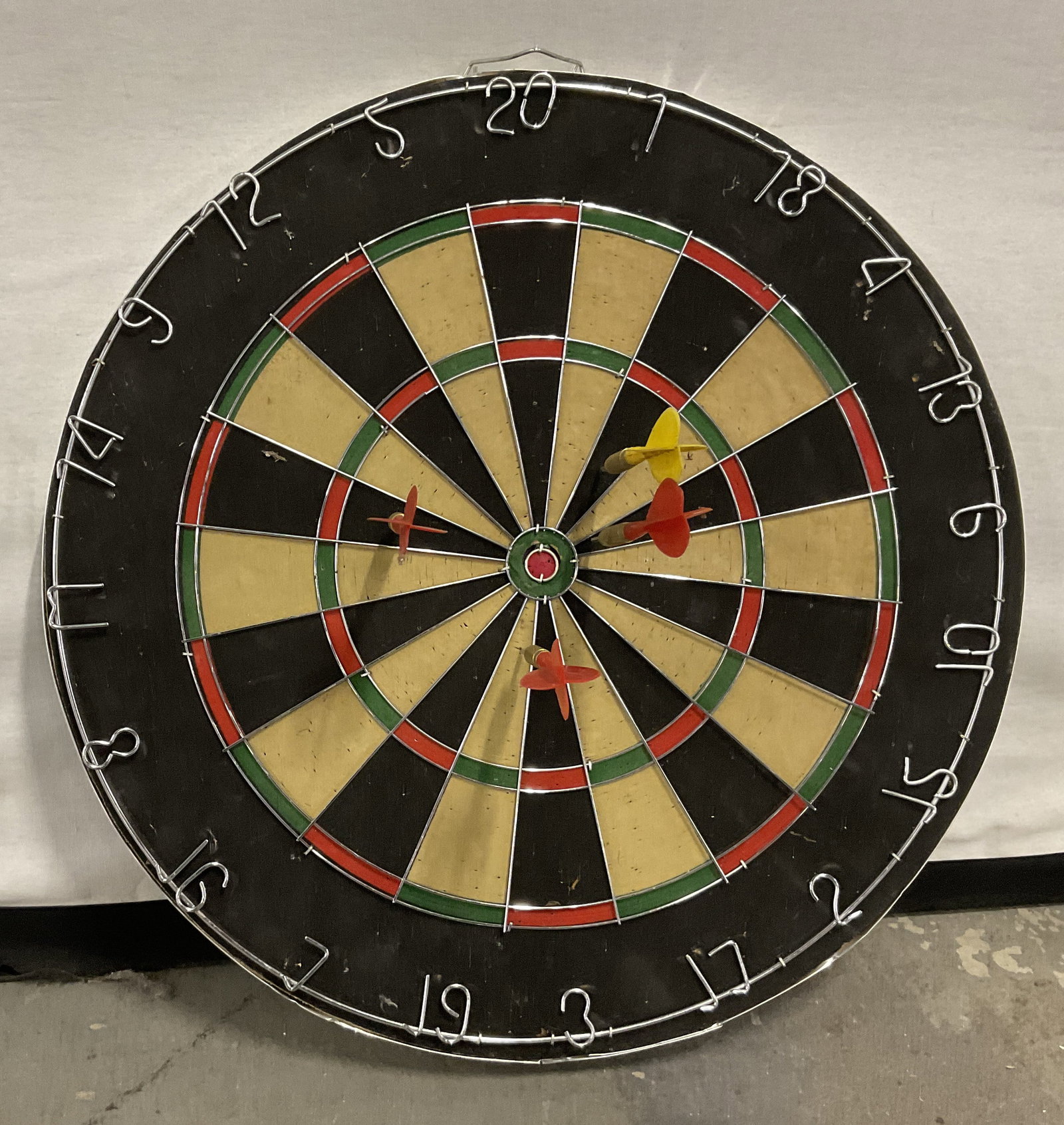 VTG-Style Tournament Bristle Dart Board w/Darts: Vintage-Style Tournament Bristle Dart Board with 4 Steel-Tip Darts. Metal Spider Wire System. Poke Holes in Board and Some Aging to Metal. Measures app 18in Diam. Vintage-Style Decor, Tournament Dart 