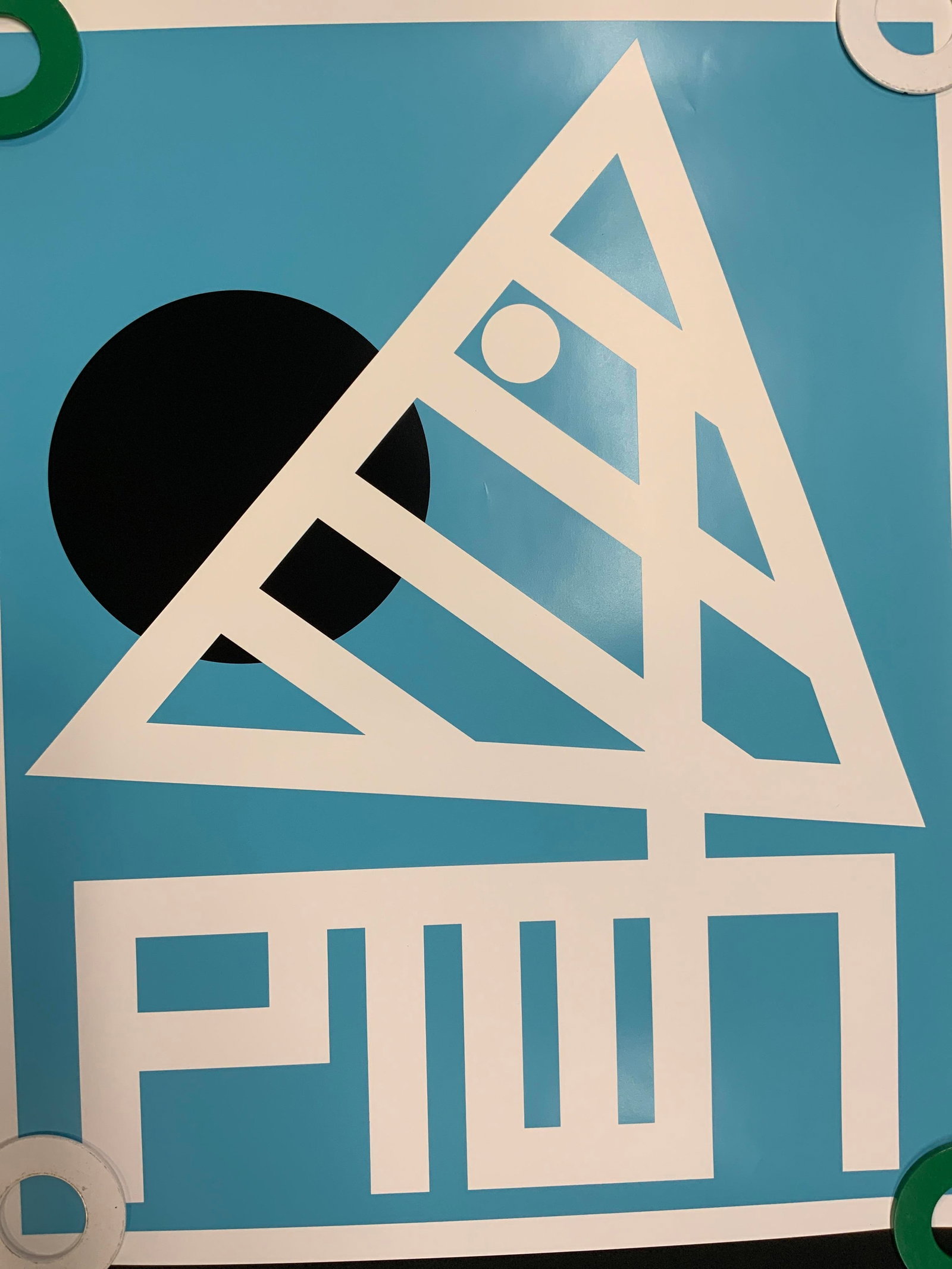 Geometric Sailboat Graphic Poster: Graphic art poster featuring a stylized abstract depiction of a sailboat. Clean geometric shapes composed of a white silhouette set against blue background. Condition consistent with age and exposure.