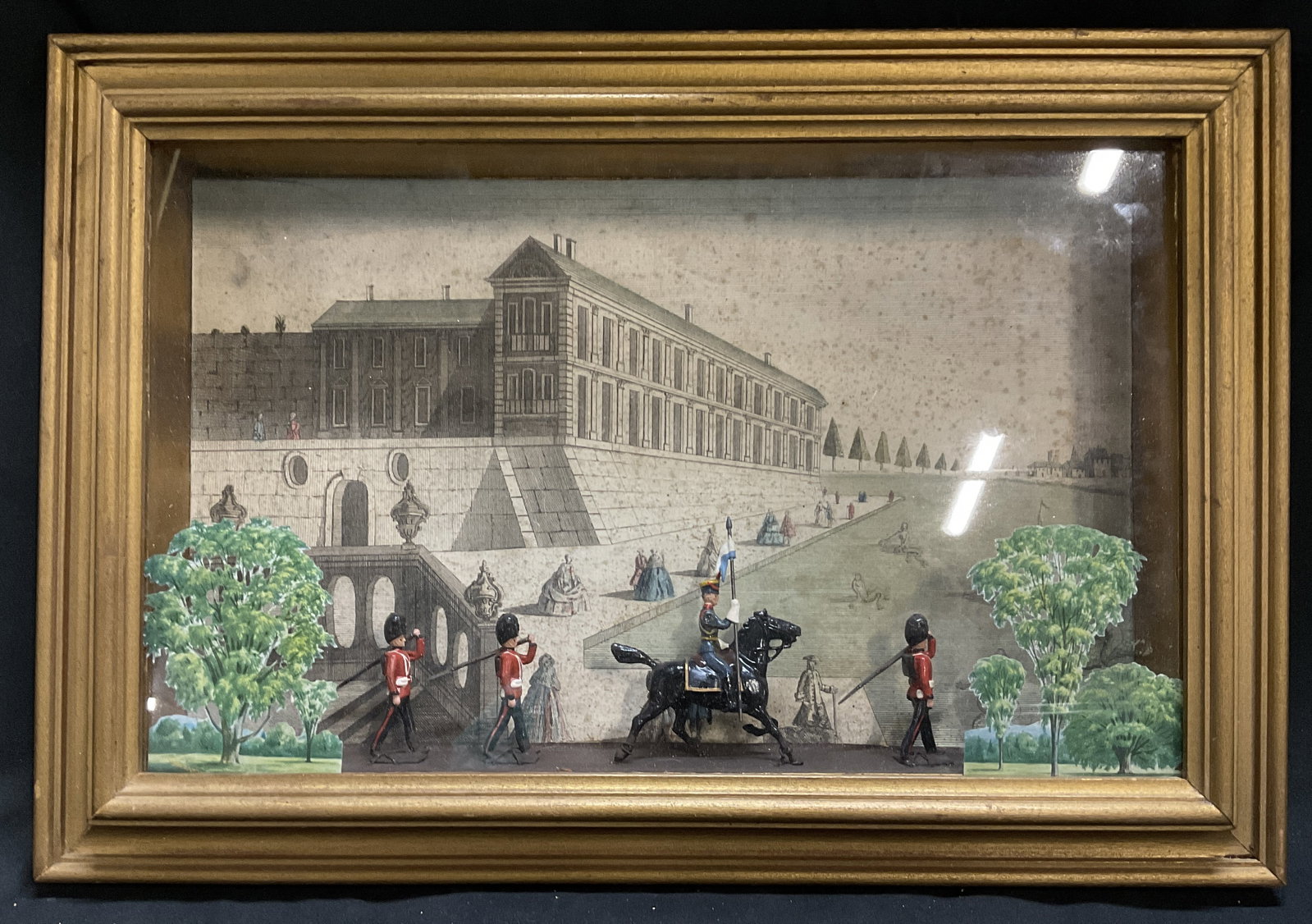 VTG 3D British Army Diorama: Vintage 3D British Army Diorama. Features British Redcoat Soldiers With an Equestrian Officer. Composite Material. Paper Tree Cut-Outs. Paper Scenery Background. Frame is Loose. Chips to Side of