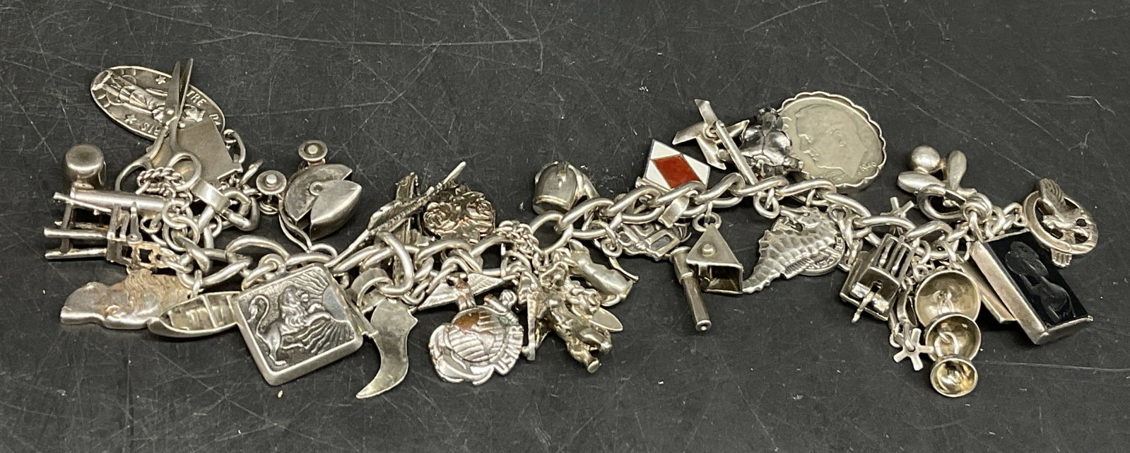 VTG STERLING SILVER Charm Bracelet: Vintage Charm Bracelet. Various Charms Such as Ships, a Cat with Violin, a Mouse, a Framed Dime, a Toaster, a Seahorse, Scissors and More. Some Charms Marked Sterling. Some Unmarked. Tarnishing and We