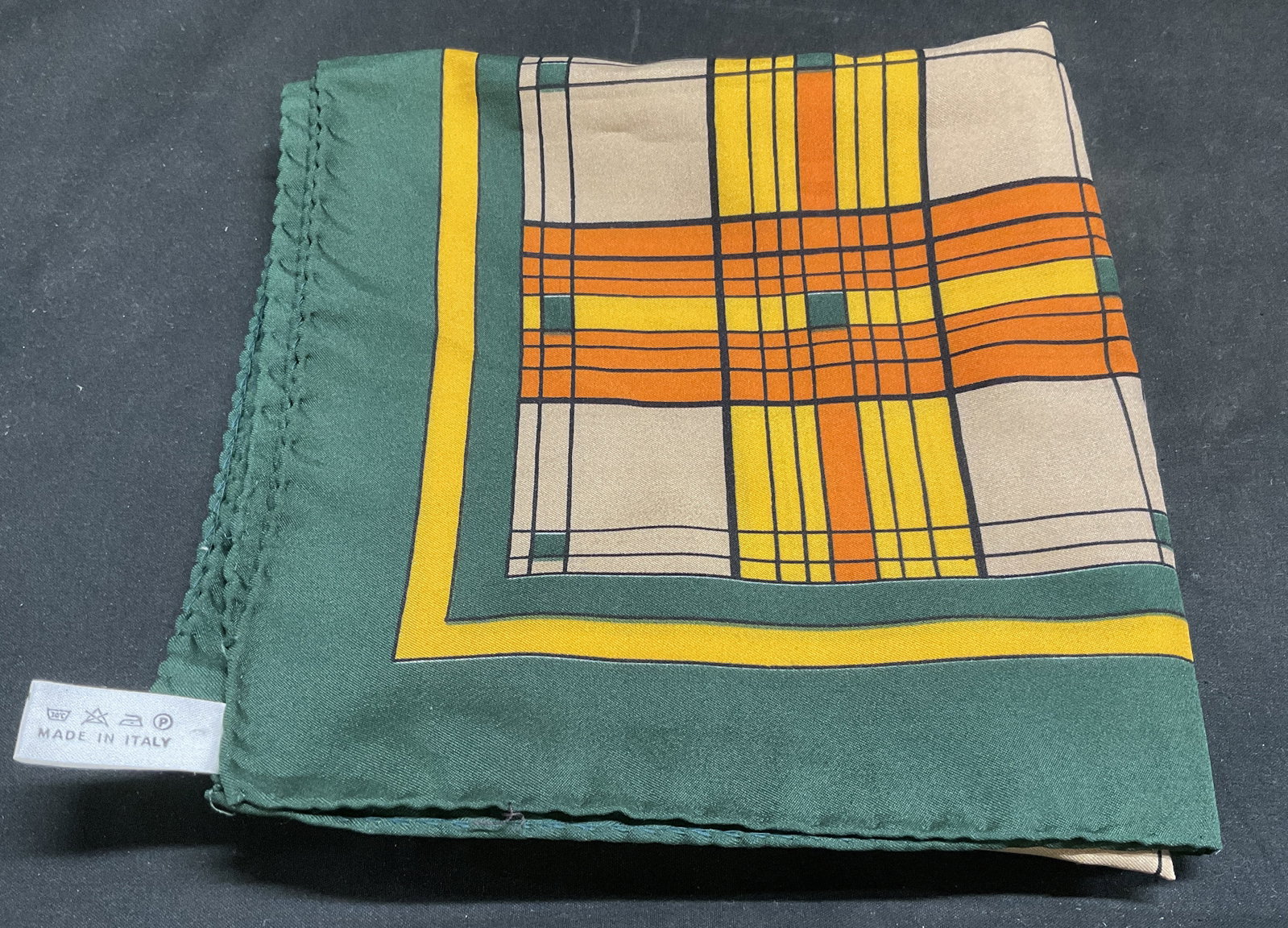 VINTAGE Wistel T Square Fashion Scarf ITALY: Vintage Wistel T Square Fashion Scarf. Green, Orange, Yellow, and Beige Plaid Pattern. Italy. Condition Consistent With Exposure. Measures app 29.5in L x 29.5in W. Vintage Scarves, Wistel T, Italy, Sq