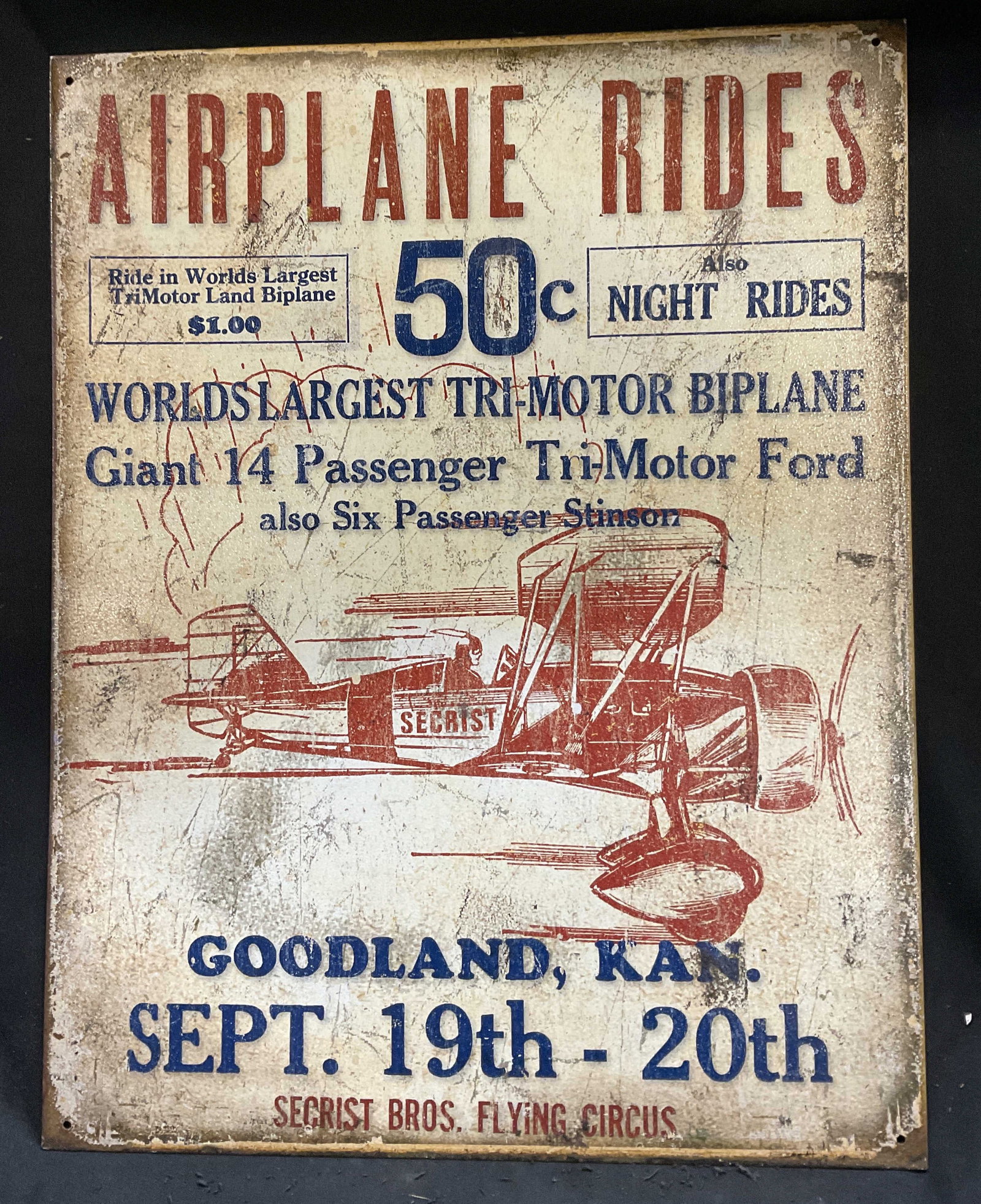 VTG-Style DE Secrist Bros Flying Circus Ad Sign: Vintage-Style 2012 Desperate Enterprises Secrist Bros Flying Circus Ford Tri-Motor Biplane Airplane Rides 1920s Advertisement Tin Sign. Red Airplane Graphic. Condition Consistent With Exposure. Measur