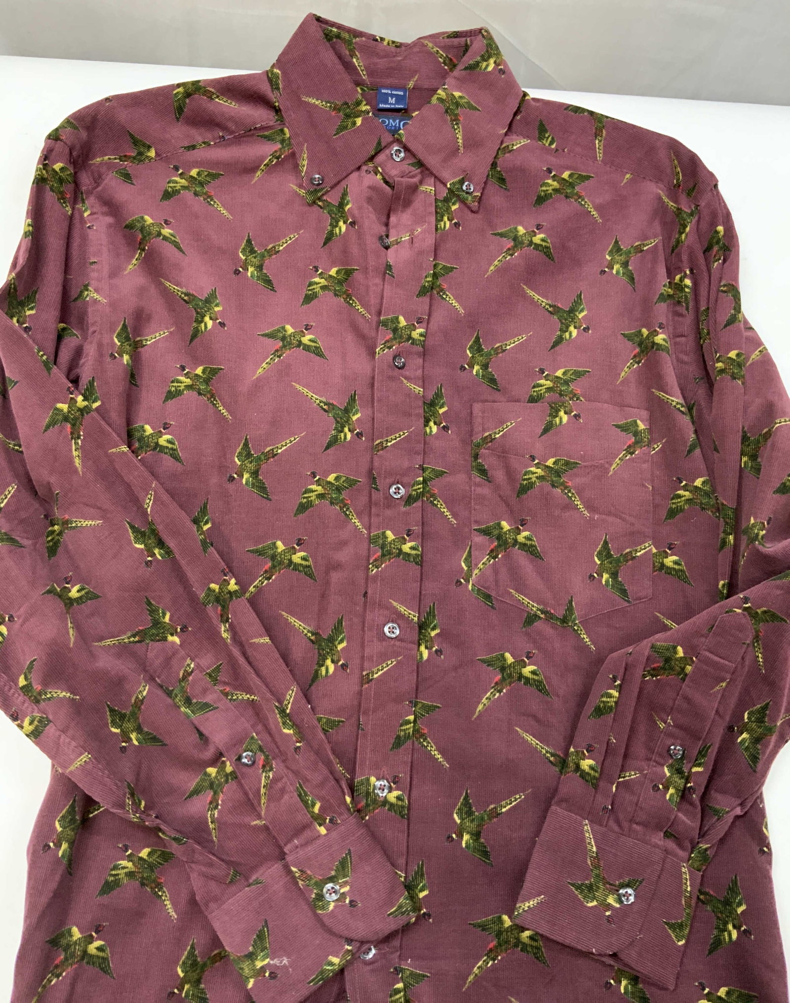 Vntg Como cotton pheasant button down Italy: Vintage Como pheasant button down. Made in Italy of 100% cotton. The shirt is made of a ribbed corduroy textured cotton. The primary base is a deep maroon that contrasts the bright colors of the birds