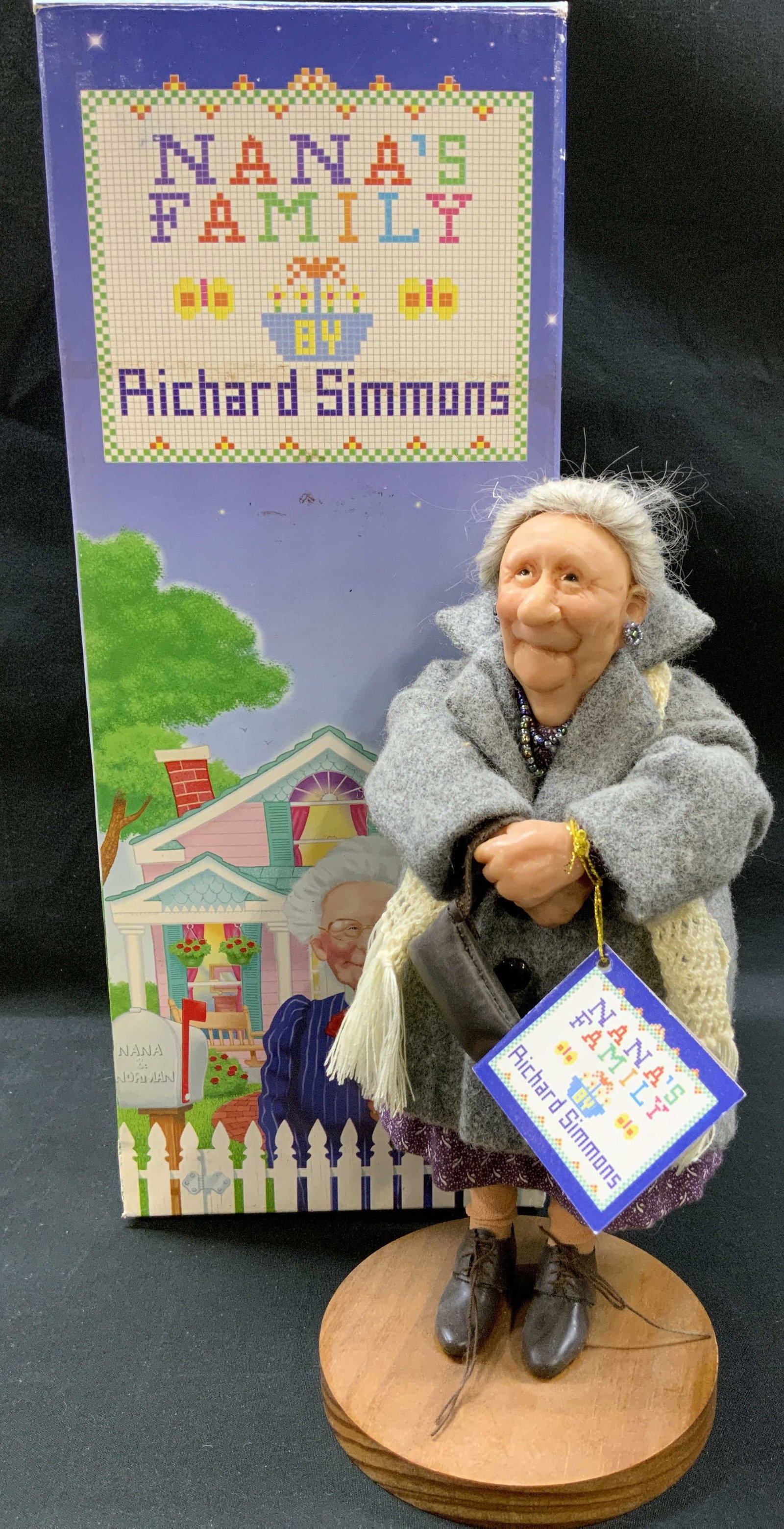 Vtg 90s Aunt Della Mae Doll Nanas Family IOB: Vintage 1990s Aunt Della Mae doll from the Nanas Family collection. Presented by Richard Simmons, designed by Annie Wahl for The L.L. Knickerbocker Co. Styled in heavy gray tweed wool winter coat, lay