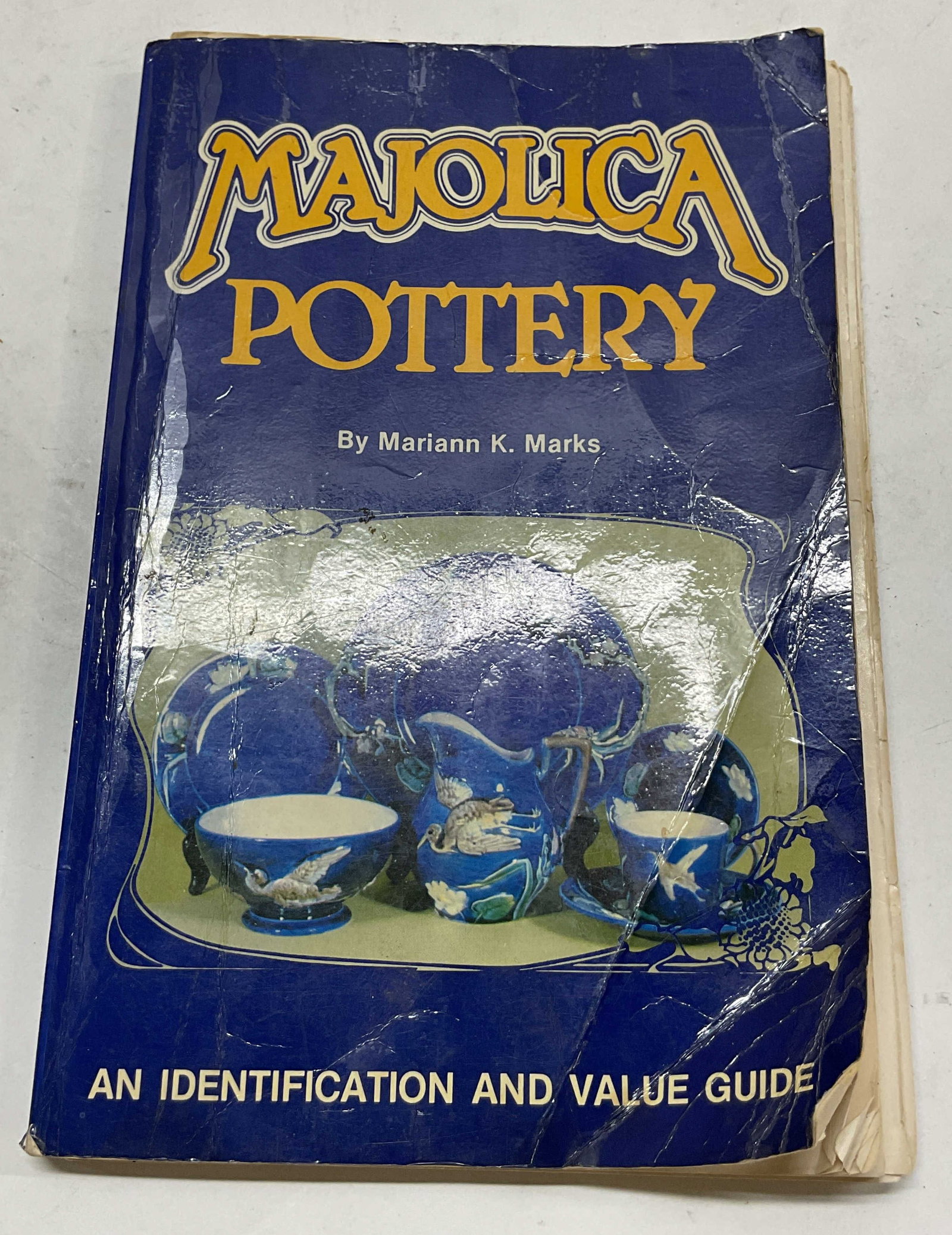 1989 Majolica Pottery Illustrated Book Marks+: Majolica Pottery An Identification And Value Guide by Mariann K. Marks. Published by Collector Books, 1989. Soft cover book with illustrated cover. Contains illustrations. Measures approx 6 x 8.5 inch