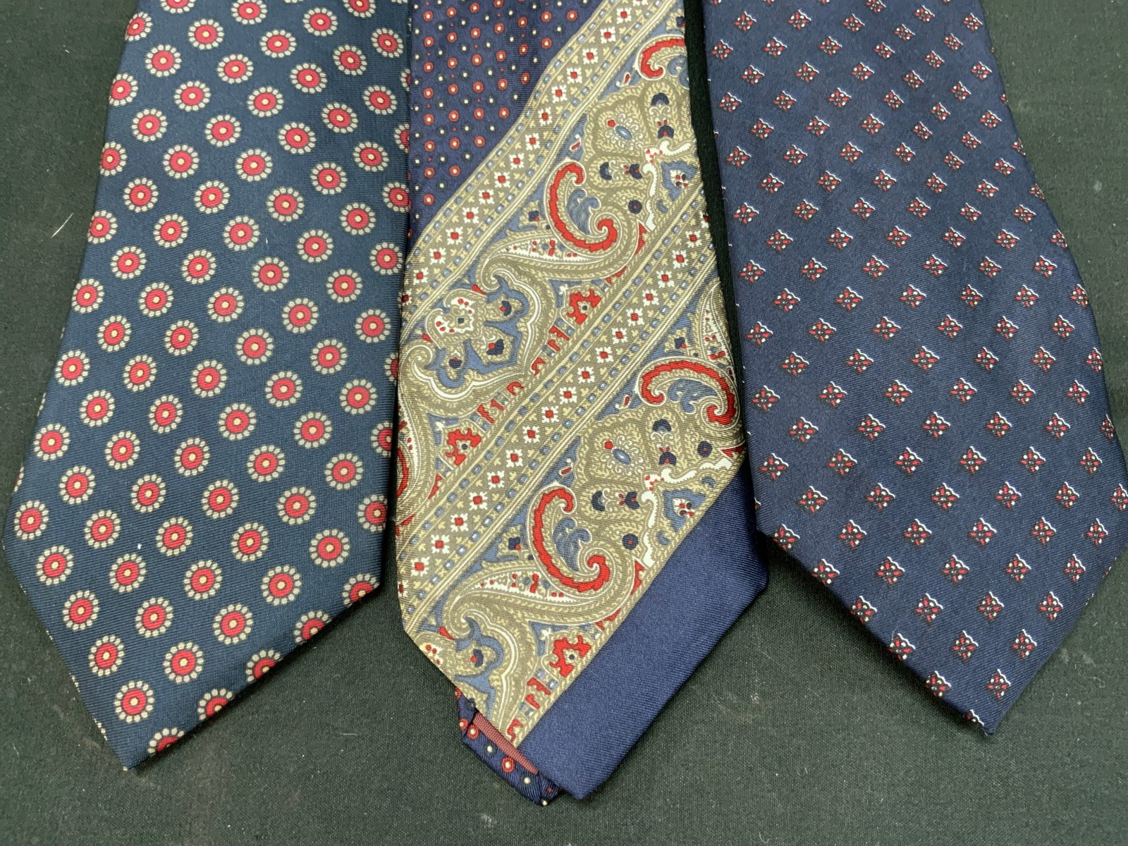 Lt3 Vtg Mens Silk Neckties Navy Blue: Lot of 3 Vintage Navy blue Mens patterned silk neckties. Includes 1x Lilly Dache tie navy blue decorated with all over geometric medallion foulard print with cream and orange accents. 1x Michel navy b