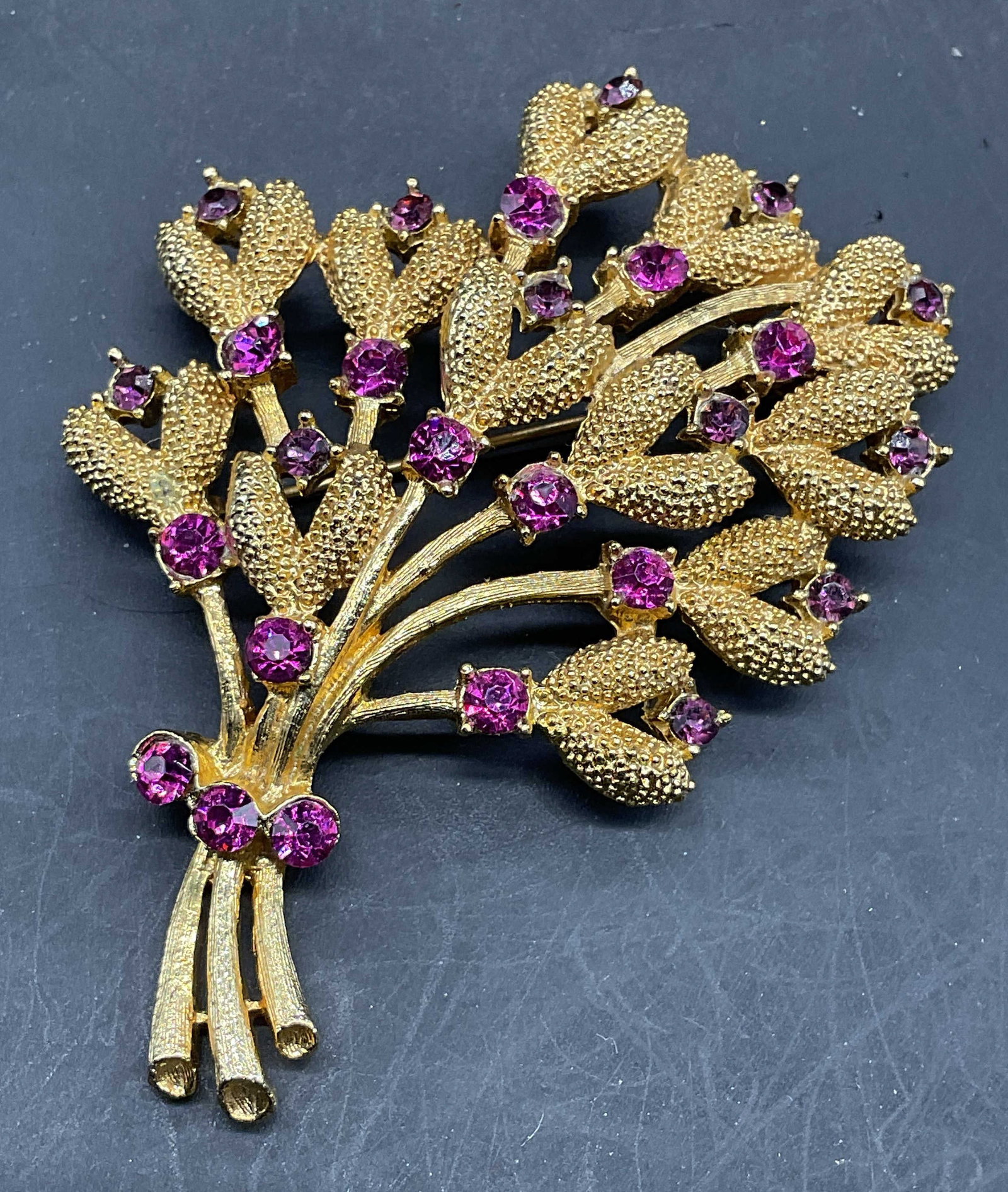 Vintage Gold Tone Crystal Flower Brooch: Vintage gold tone flower brooch with pink crystals. Measures approx. 2.5 x 2 inches. Some scratching. Jewelry, estate jewelry, costume jewelry, cocktail jewelry, fashion jewelry, accessories, fashion 