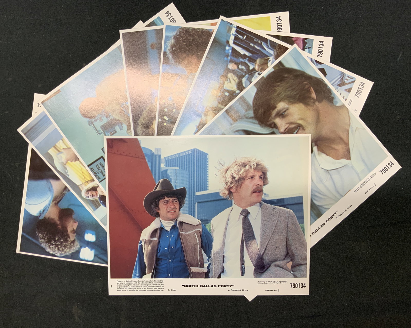 Lt8 Vtg 1979 North Dallas Forty Lobby Cards: Lot of 8 vintage 1973 North Dallas Forty original lobby cards. Complete set, studio issued promotional lobby cards directed by Ted Kotcheff. Actors Nick Nolte, Mac Davis, Charles Durning. Distributed