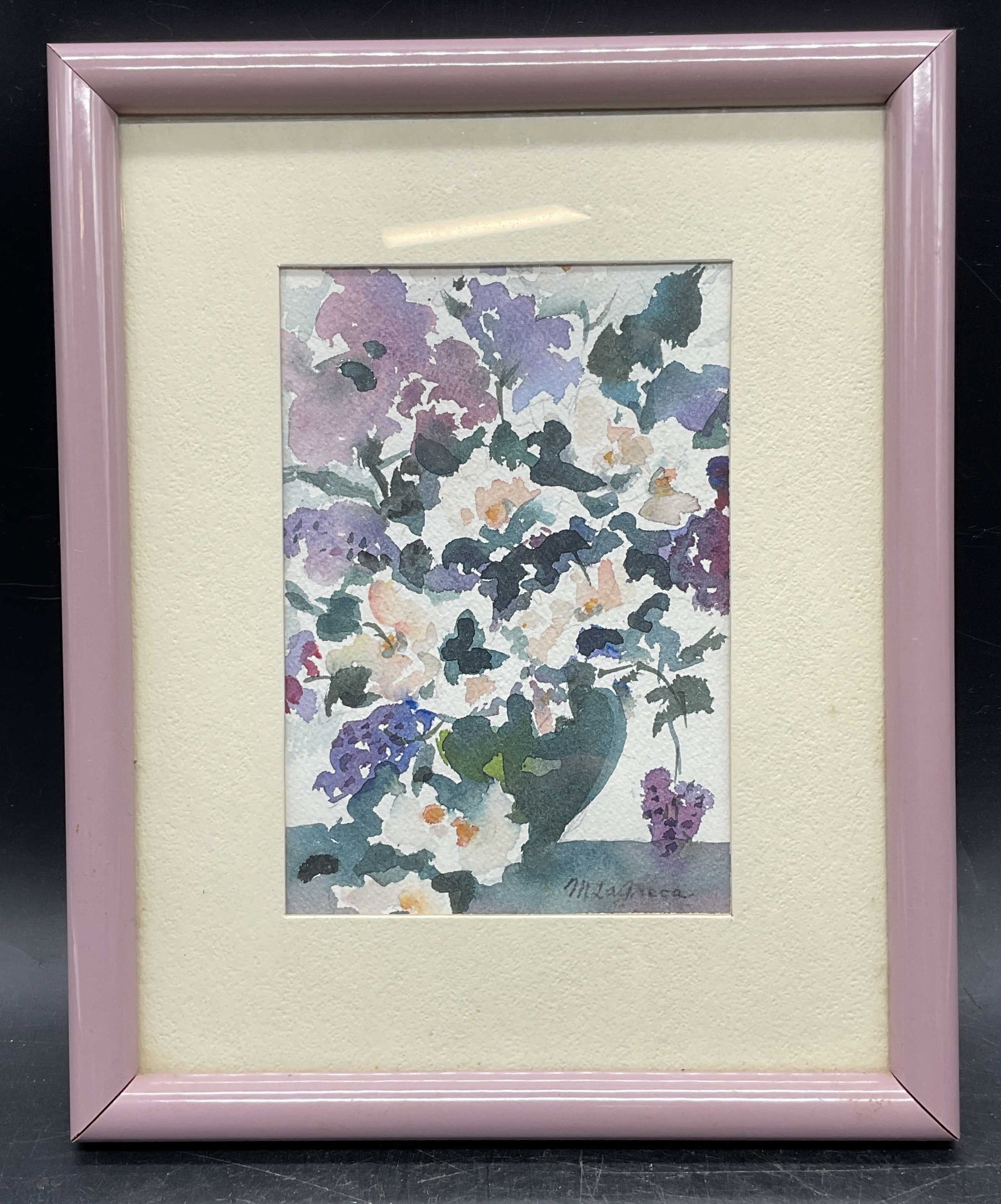 Sgn Mary LaGreca Still Life Watercolor Painting: Framed and matted watercolor painting. Signed lower right Mary LaGreca (American, d. 2001). Still life with vase of flowers. Purple frame. Not examined out of frame. Frame measures approx. 10.75 x
