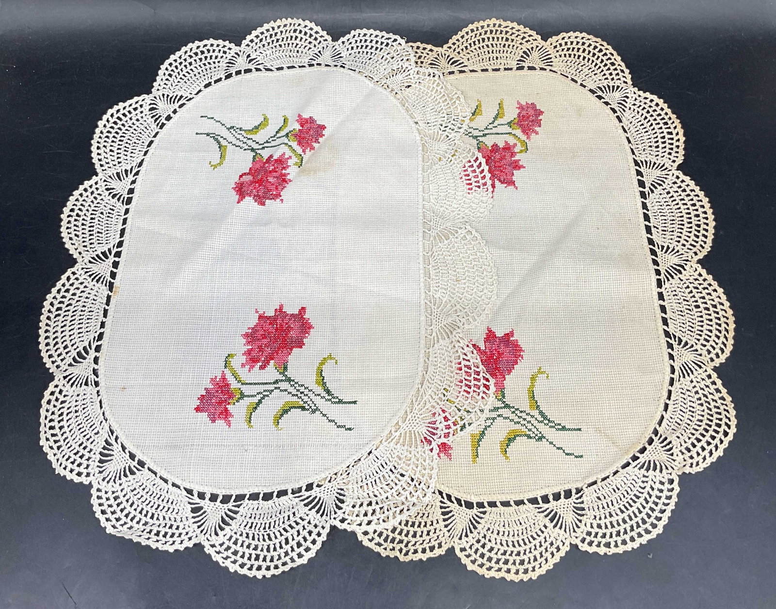 Pair Vintage Cross Stitch Floral Lace Doilies: Pair of vintage white cotton floral cross stitch embroidered doilies with lace edges. Measures approx. 14.25 x 10.75 inches. Some blemishes. Doily, lace doily, floral doily, cross stitch doily,