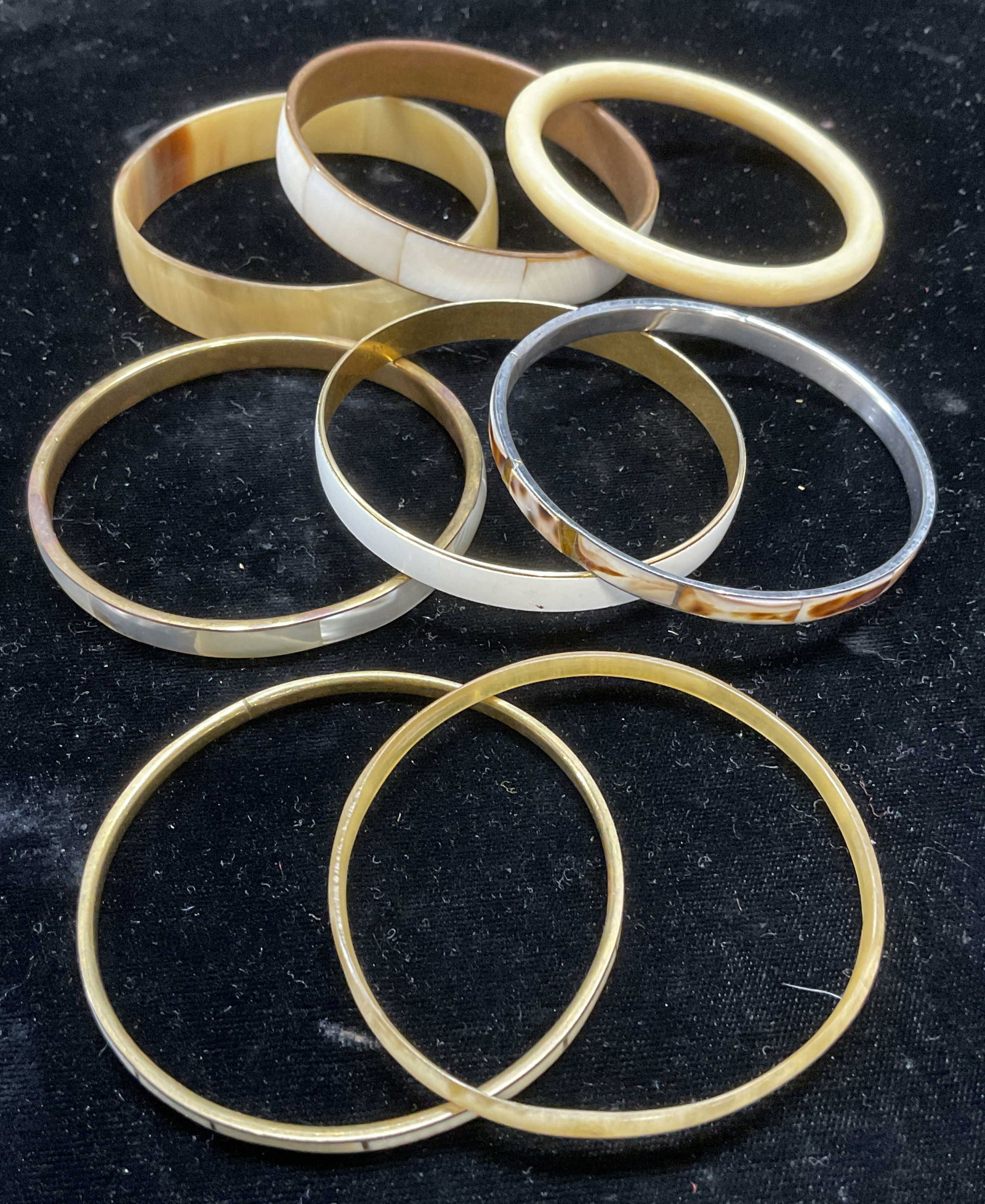 Lot 8 Bone, Horn, Shell Enamel Bangle Bracelets: Lot of 8 bangle bracelets. Bone, horn, shell, and enamel. Largest approx 2.75 inches wide. All pieces have wear including scratching. Jewelry, estate jewelry, costume jewelry, cocktail jewelry,