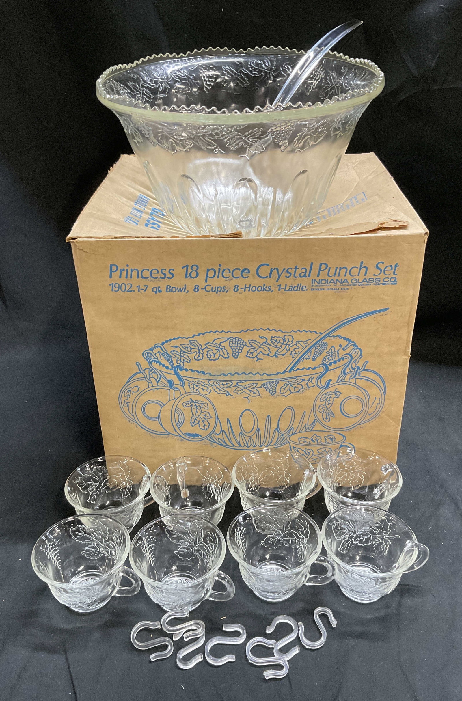 Indiana Glass Co Princess Crystal Punch Set OB: Vintage Circa 1970s Indiana Glass Co Princess Crystal Punch Complete Set in Original Box. Includes Punch Bowl, 8 Cups, 8 Hooks, and 1 Plastic Ladle. Embossed Grape Clusters, Vines, and Leaves.