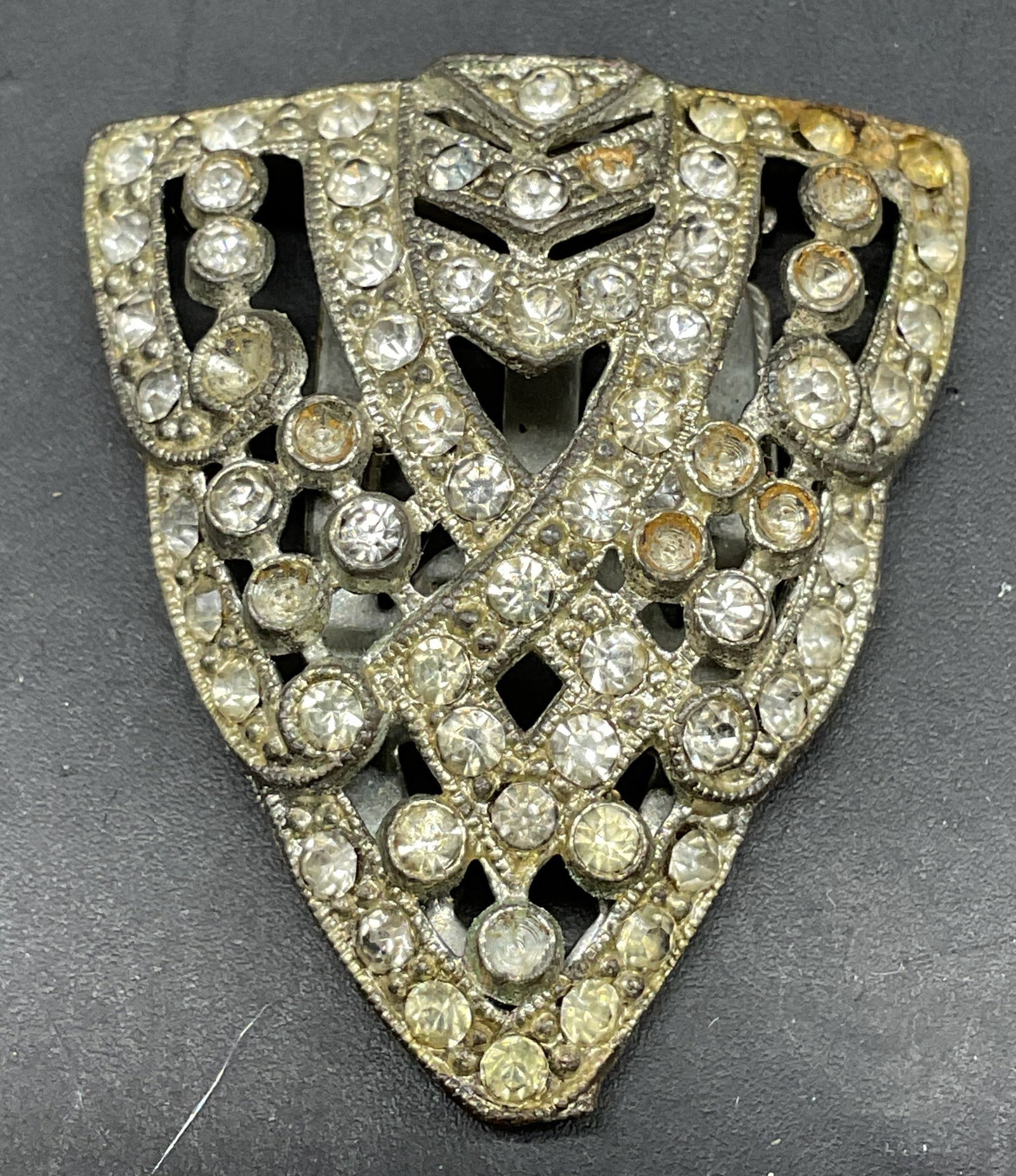 Art Deco Style Silver Tone Rhinestone Fur Clip: Art deco style silver tone rhinestone fur clip. Measures approx. 1.5 x 1.25 inches. Some rhinestones need replacement. Some scratching. Jewelry, estate jewelry, costume jewelry, cocktail jewelry,