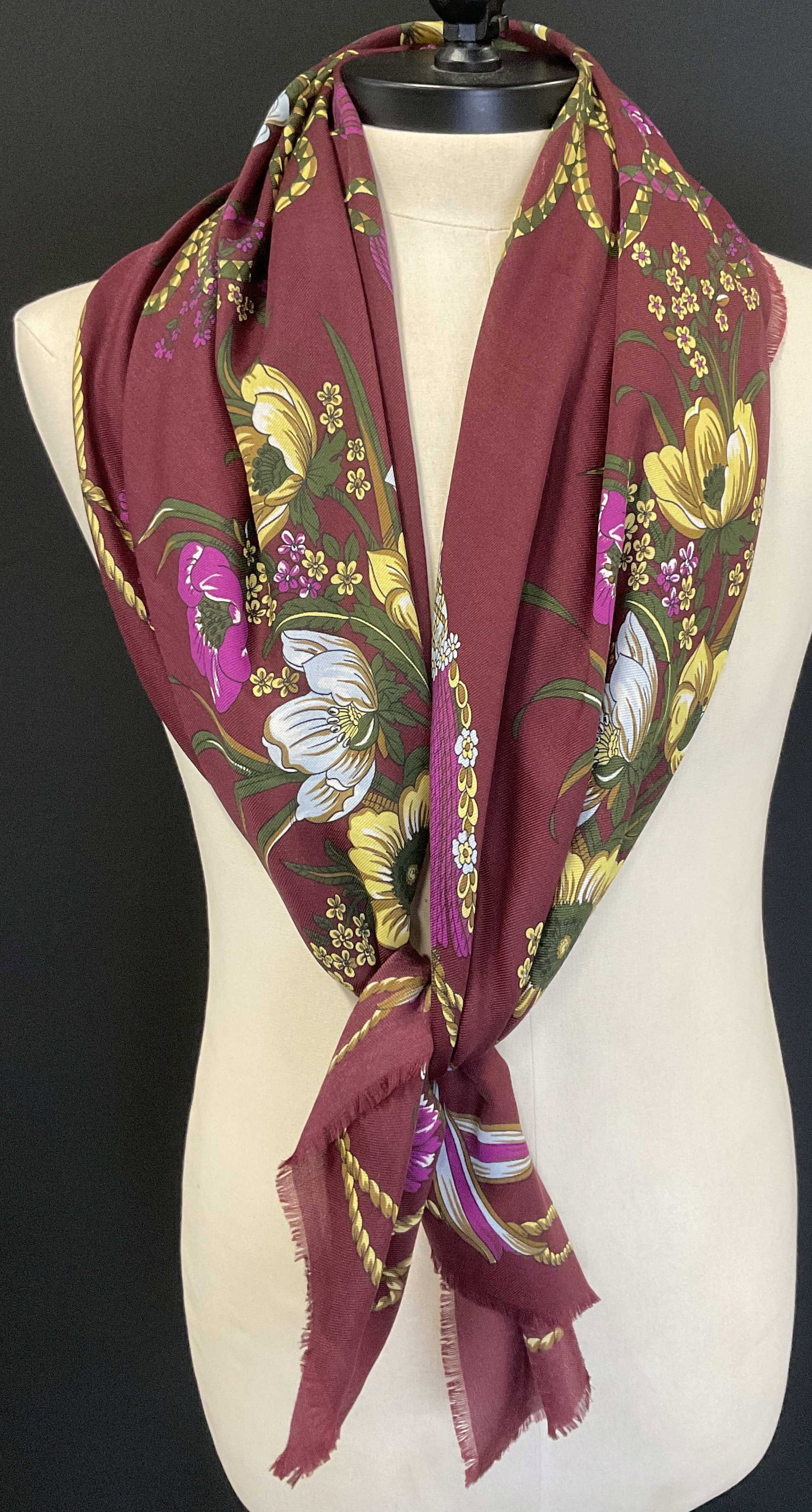 VINTAGE Burgundy Botanical Scarf ITALY: Vintage Burgundy Scarf. Botanical Yellow and White Blossoms and Tulips Design. Striped Ribbon Motifs. Rope Border. Fringed Edges. Italy. Condition Consistent With Exposure. Measures app 45in L x