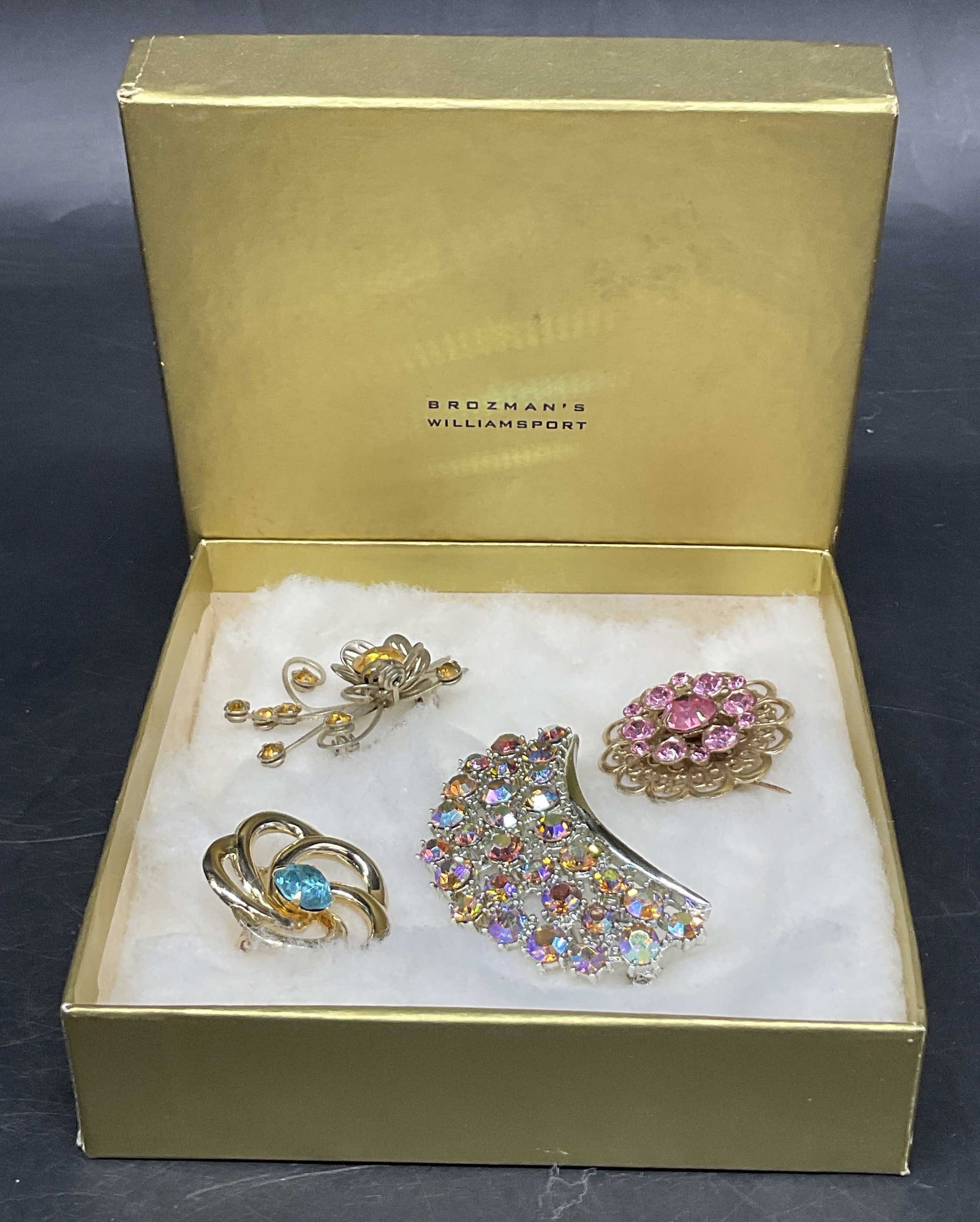 Lt4 VTG 50s-60s Jeweled Costume Brooches OB: 4 Vintage Circa 1950s-1960s Jeweled Costume Brooches. Comes with Vintage Brozmans Department Store Box From Williamsport, Pennsylvania. Includes a Silver-Toned Crescent Moon Pin with Aurora Borealis R