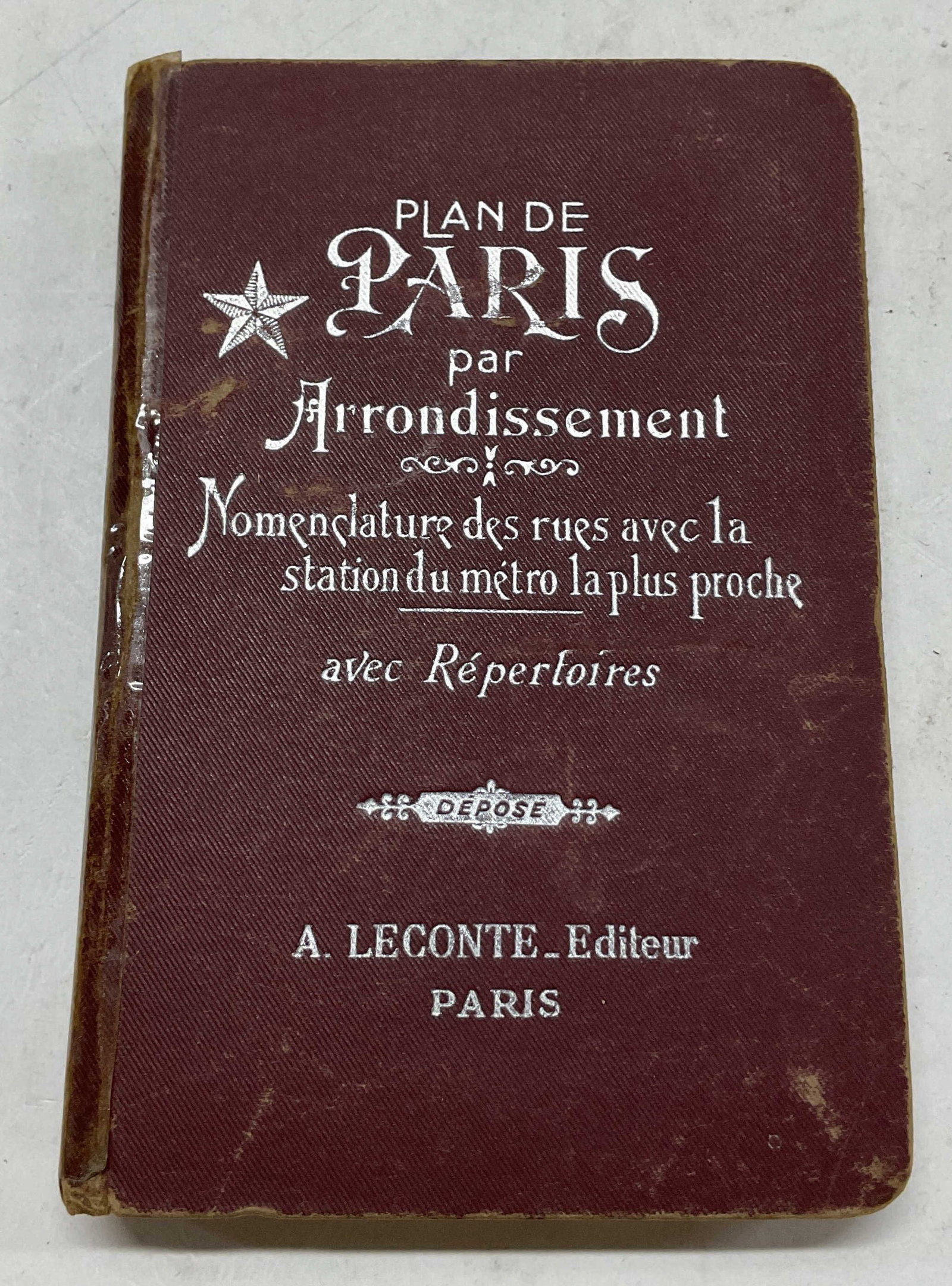 C1940s Guide Indicateur Des Rues De Paris Illus: Circa 1940s. Guide Indicateur Des Rues De Paris. Published by A Leconte. Hard cover with silver toned embossed trim. Text reads in French. Includes map illustrations. Pocket street guide, how to