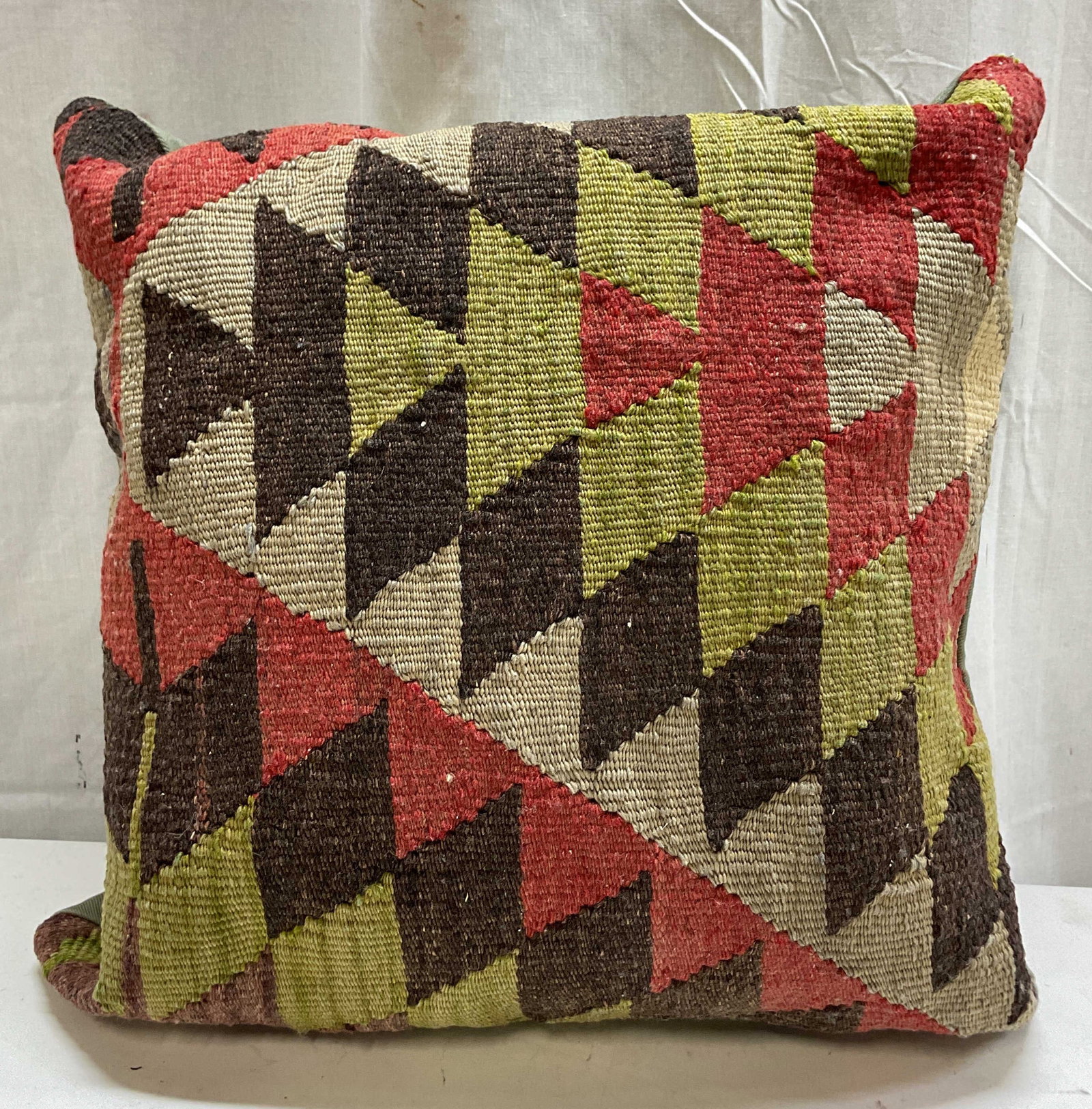 Vintage Hand Made Wool Kilim Throw Pillow Turkey: Vintage hand made wool Kilim throw pillow. Made in Turkey. 100% hand made wool Kilim and leather. Vibrant geometric diamond pattern in shades of orange, olive green, and dark brown. Light green back. 