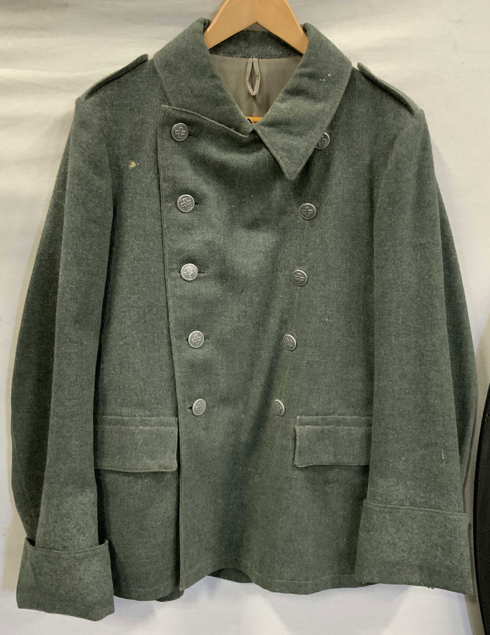Vntg Swiss army jacket. Wool, Switzerland: Vintage Swiss army jacket. Made of 100% wool made in Switzerland. Double breasted design with the Swiss cross on each metal button. Belt on the back and belt support hooks. Size 50 added to inside. Al