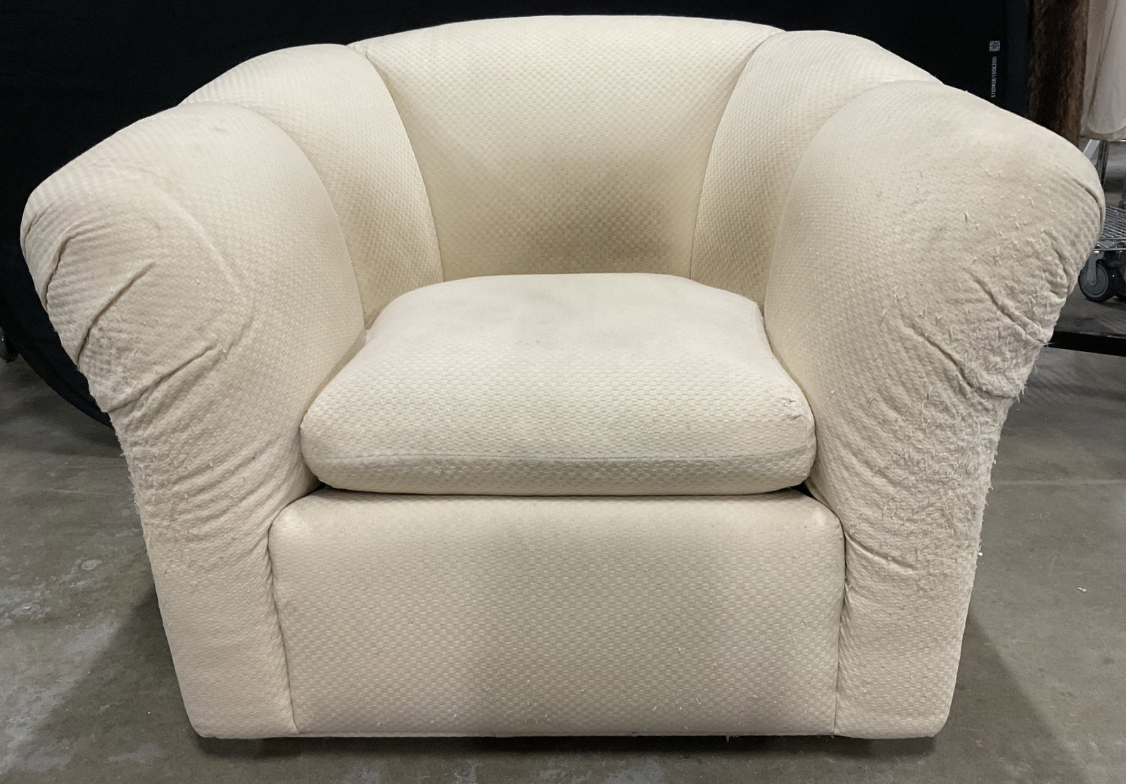 Vintage Upholstered Club Chair W/ Cushion: Vintage Upholstered Club Chair. Comes with a removable cushion. Cream hued soft hand upholstery to the piece. Measures approx. 40W x 29H x 31D in. Tag beneath the cushion. Discoloration, losses to fab