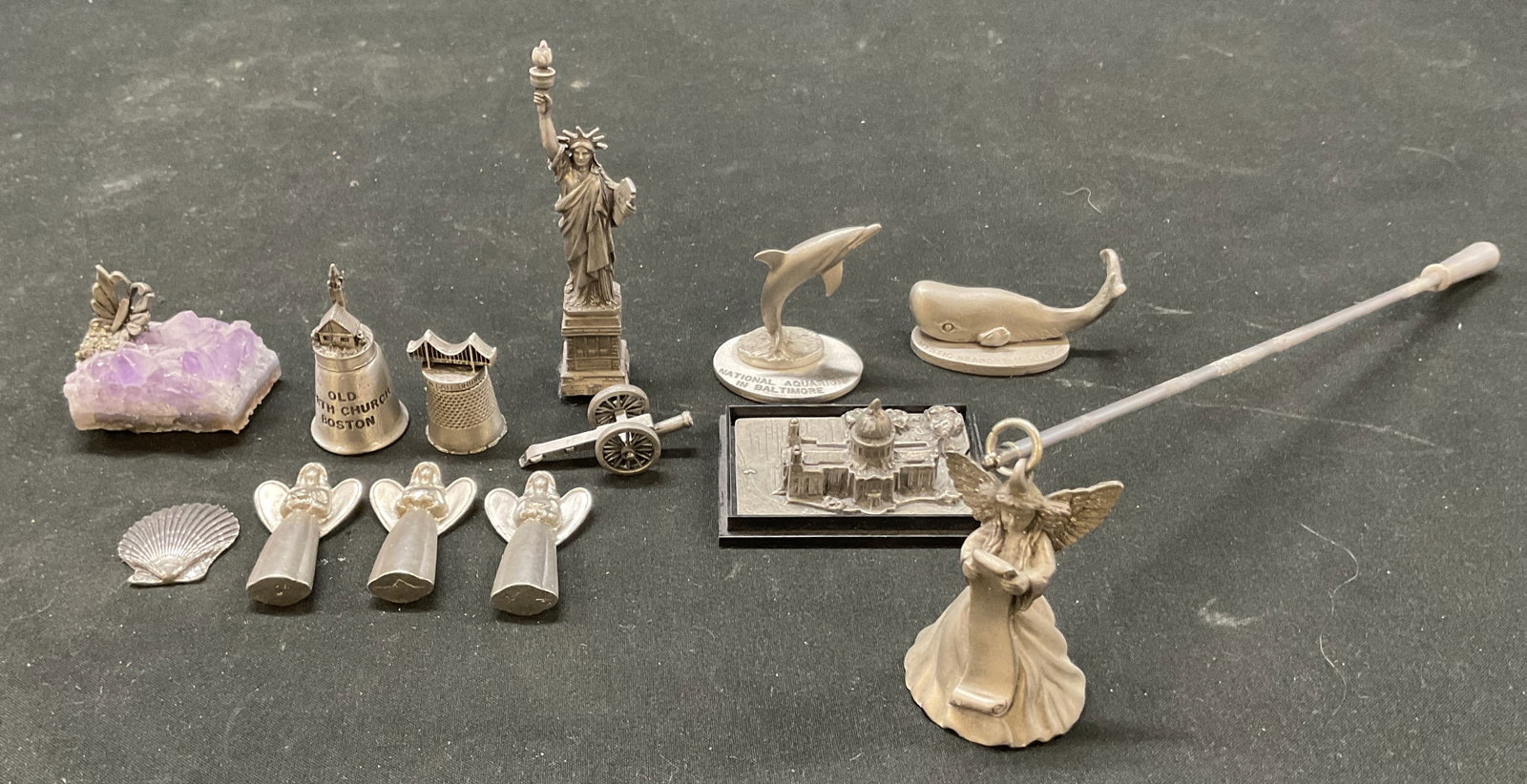 Grp Lot 13 Pewter Souvenir Figures England+: Group lot of 13 items. Includes pewter angel candle snuffer. Two Spoontiques pewter dolphin and whale souvenirs USA, from the National Aquarium In Baltimore and Mystic Seaport Mystic CT. Rowena
