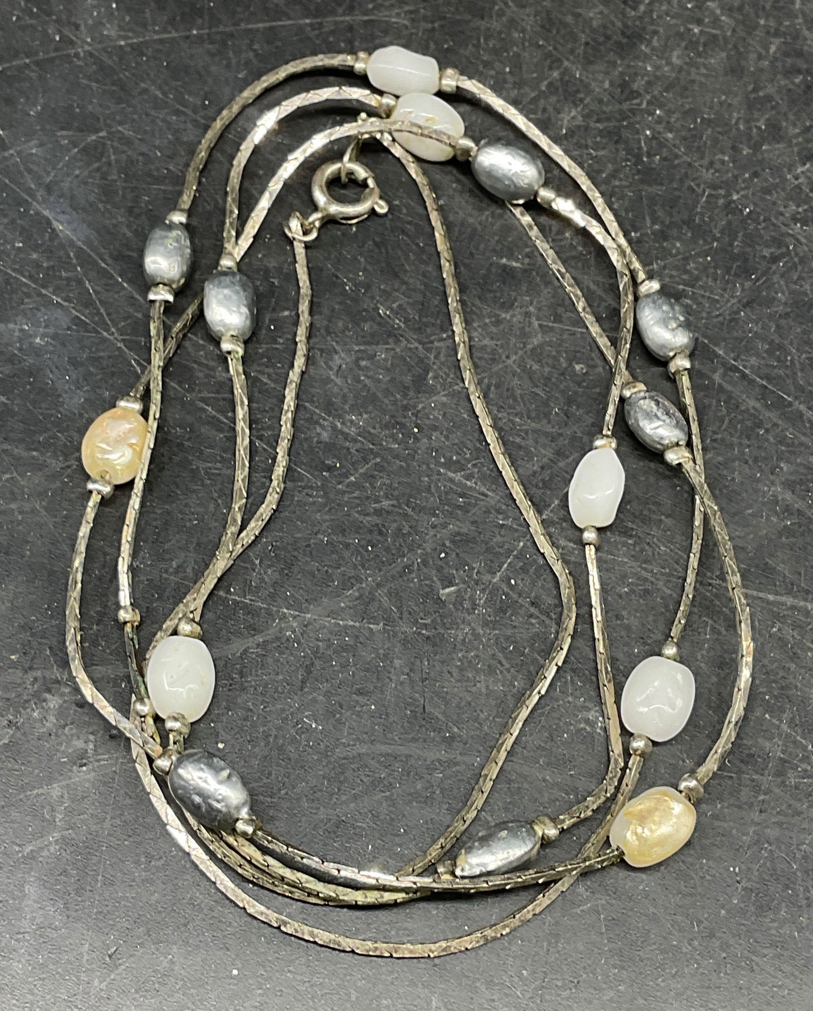 Vintage Silver Tone Faux Pearl Necklace: Vintage silver tone faux pearl beaded necklace. Drop length measures approx. 24.75 inches. Some scratching. Jewelry, estate jewelry, costume jewelry, cocktail jewelry, fashion jewelry, accessories, fa