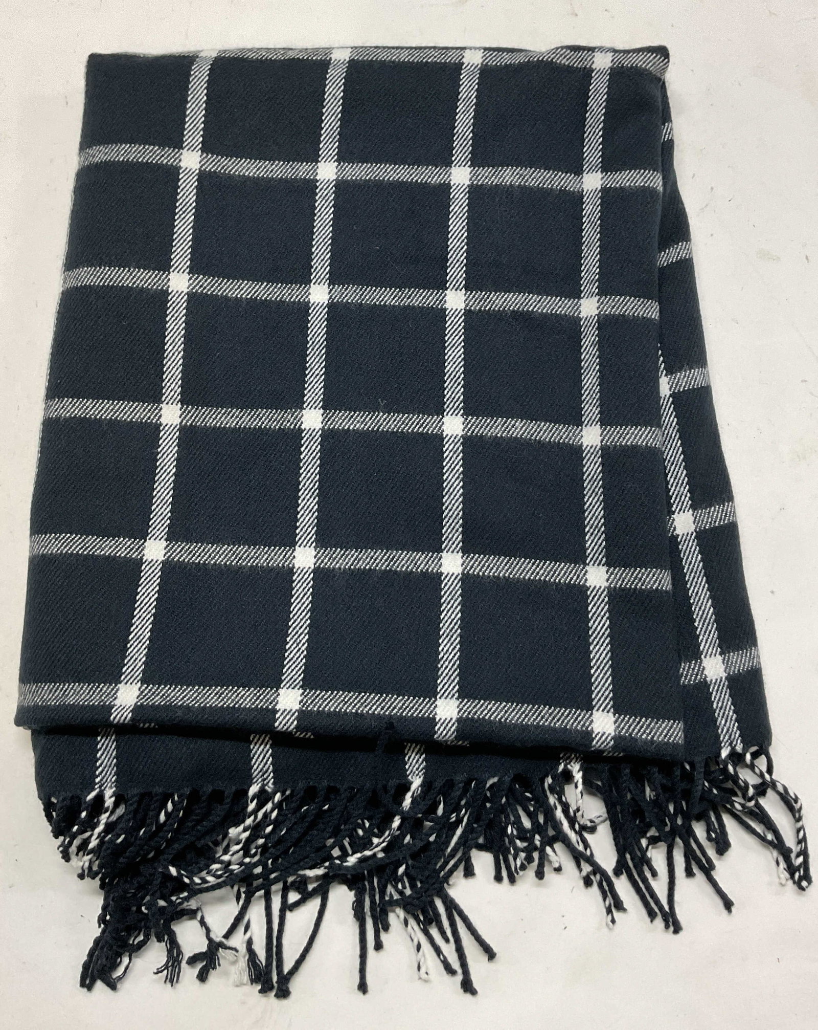 J. Crew Navy & White Plaid Fringed Wrap Shawl: J. Crew navy and white plaid fringed wrap shawl. 100% acrylic. Navy and white fringed trim. Navy and white plaid pattern. Measures approx 52 x 62 inches. Wear consistent with exposure. Shawl, scarf, w