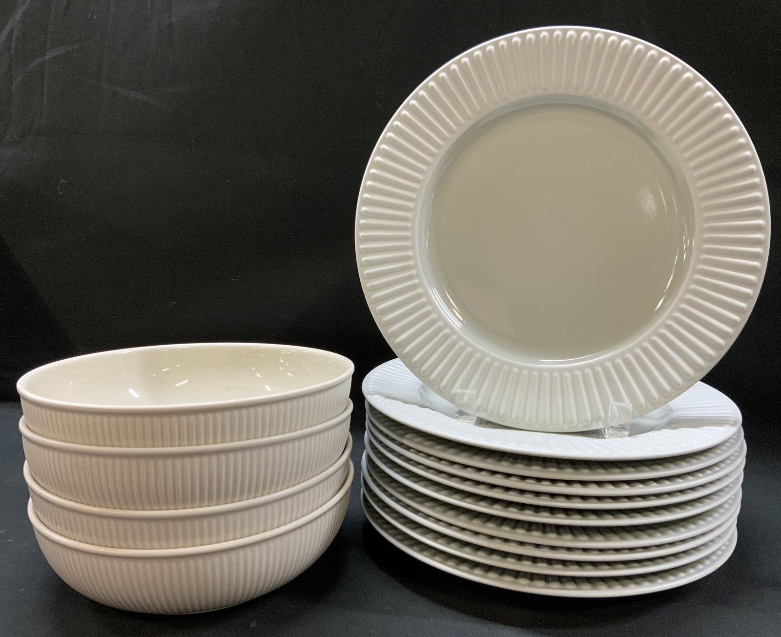 Vtg Lt14 DANSK Ribbed Dinnerware, Japan: Vintage lot of 14 DANSK ribbed Dinnerware. Neutral tone stoneware dinner plates and bowls. Includes: 10x Dinner/Salad Plates, 4x Deep Bowls. Stamped on underside DANSK INTERNATIONAL DESIGN LTD. NR/JAP