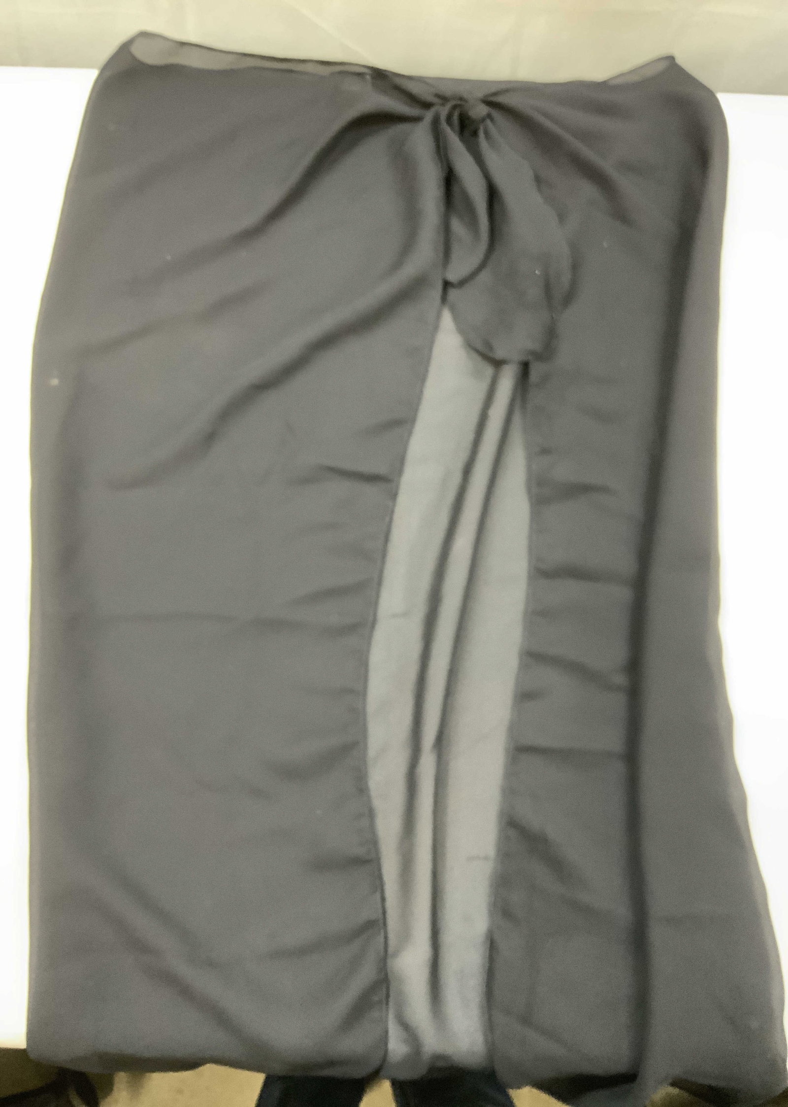 Vntg Dotti sheer black tie front wrap skirt , USA: Vinatge Dottie sheer black tie front wrap skirt. Made in the USA from 100% polyester. Primarily designed as a beach or poolside cover up. Crafted from a lightweight chiffon or mesh fabric. Features a