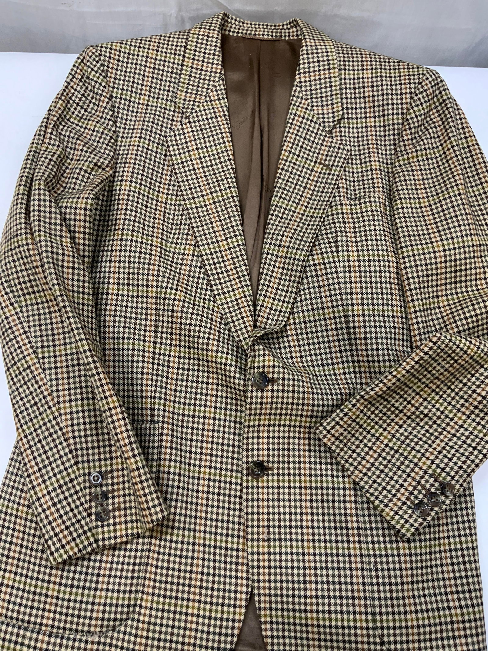 Vntg Scabal houndstooth blazer, Western Germany: Vintage Scabal houndstooth blazer. Made in Western Germany of 100% pure new wool. Multi colored houndstooth broken check pattern composed of brown, beige, tan , orange, and dark green. Features a