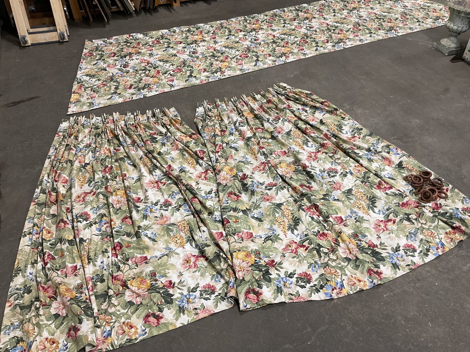3pc Ralph Lauren Floral Curtain Set W Hooks: 3 piece Ralph Lauren floral curtain set. Includes two curtain panels and a long additional panel, possibly a valance. Lot includes 24 round wooden curtain rings affixed with a screw eyelet. Cream