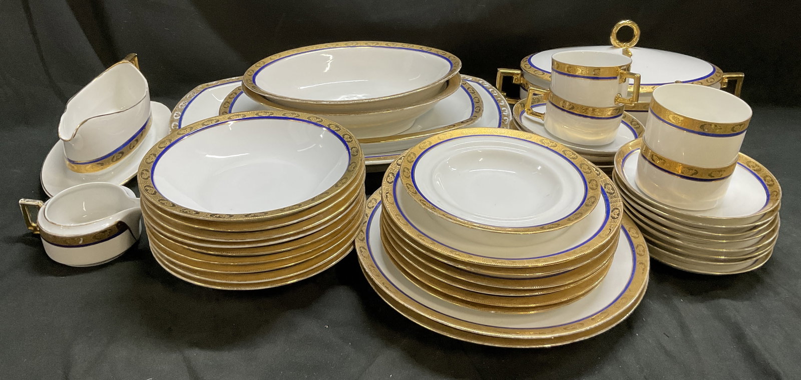 VTG 45PC Royal Bavaria Porcelain Dinner Set GERM: Vintage Set of 45 Royal Bavaria Porcelain Dinnerware. Germany. Gilt Trim with Floral Design and Cobalt Blue Accent Lines. Includes 1 Gravy Boat on Underplate, 1 Creamer Dish, 4 Teacups, 1 Tureen, 9