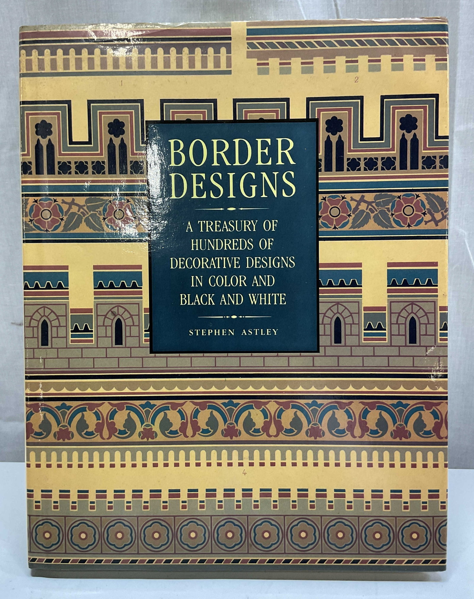 1990 Border Designs Illus Bk Astley+: Border Designs A Treasury Of Hundreds Of Decorative Designs In Color And Black And White by Stephen Astley. Published by Portland House, 1990. Contains illustrations. Hard cover book with illustrated