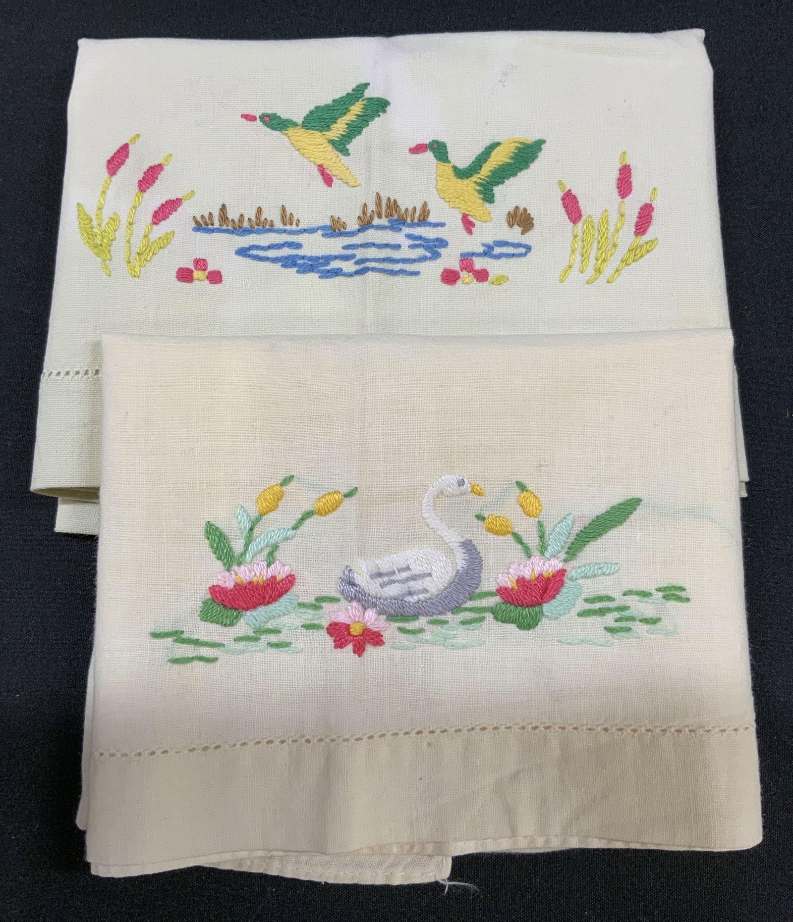 Set of 2 Vintage Embroidered Bird Linens: Set of 2 Vintage Embroidered Bird Handkerchiefs. Includes: 1x cream colored linen with embroidered white swan gliding through water, flanked by green lily pads, blooming pink water Lillies and yellow