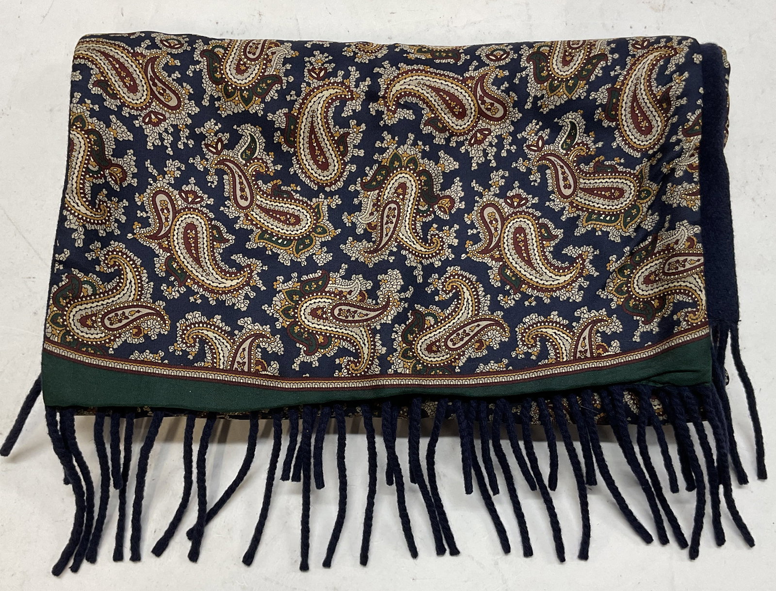 Vtg Blue Paisley Wool & Silk Fringed Scarf Italy: Vintage blue paisley wool and silk fringed scarf. Hand made in Italy. 100% pure silk 100% pure wool reversible. Blue fringed trim. Green border. Paisley pattern in blue, red, white, etc. Measures appr