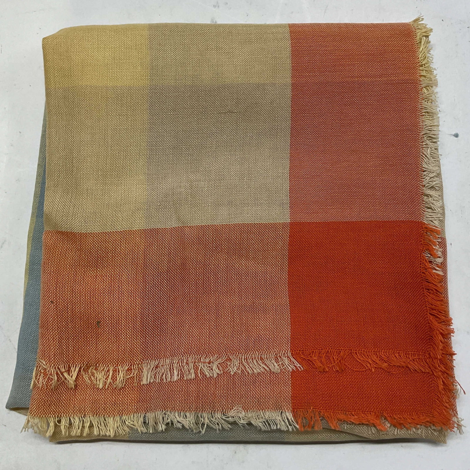 Knize Geometric Multicolor Fringed Scarf: Knize geometric multicolor fringed scarf. Fringed trim. Geometric pattern in orange, blue, green, yellow. Sheer design. Measures approx 41 x 41 inches. Wear consistent with exposure. Scarf,