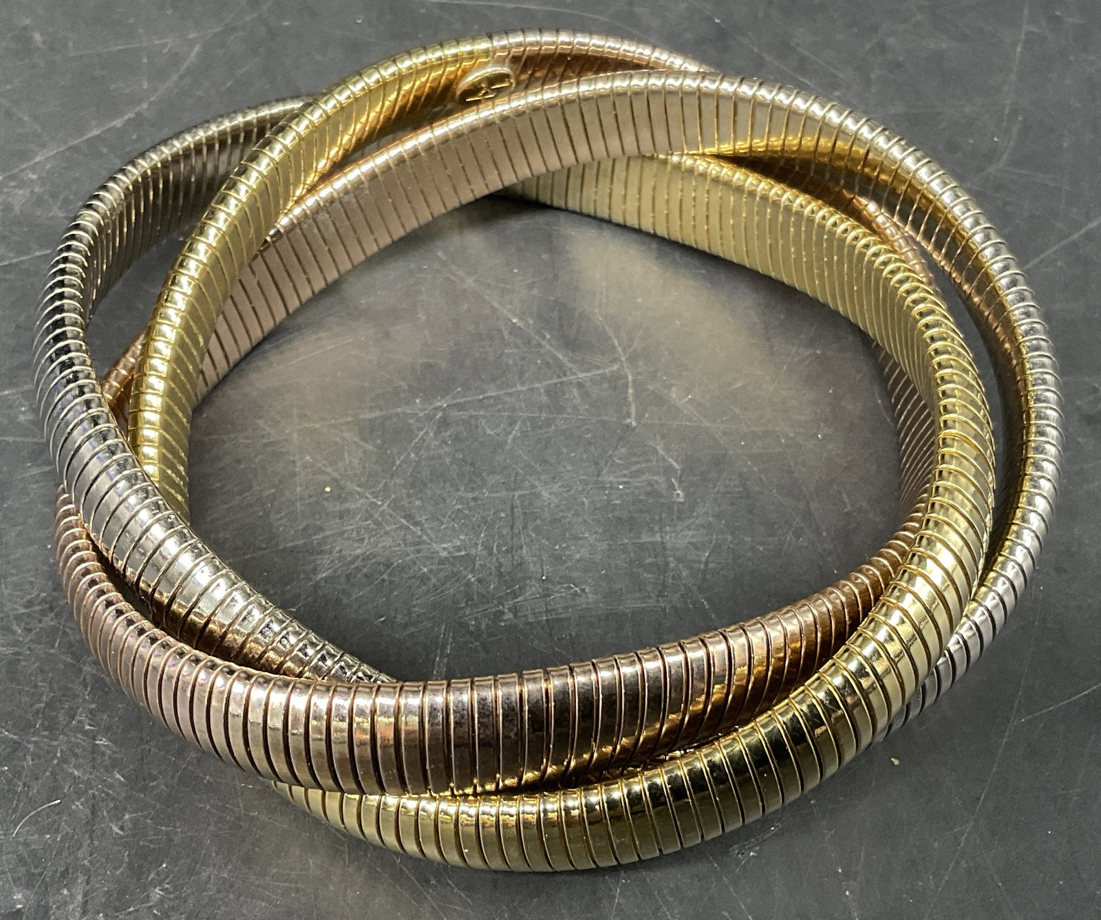 Tri-Color Snake Chain Bracelet: Tri-Color Metal Snake Chain Bracelet. Silver-Toned, Rose-Gold, and Gold-Toned Strands. Condition Consistent With Exposure. Measures app 3in Diam. Tri-Color, Metal, Snake Chain, Bracelets, Cuffs, Silve
