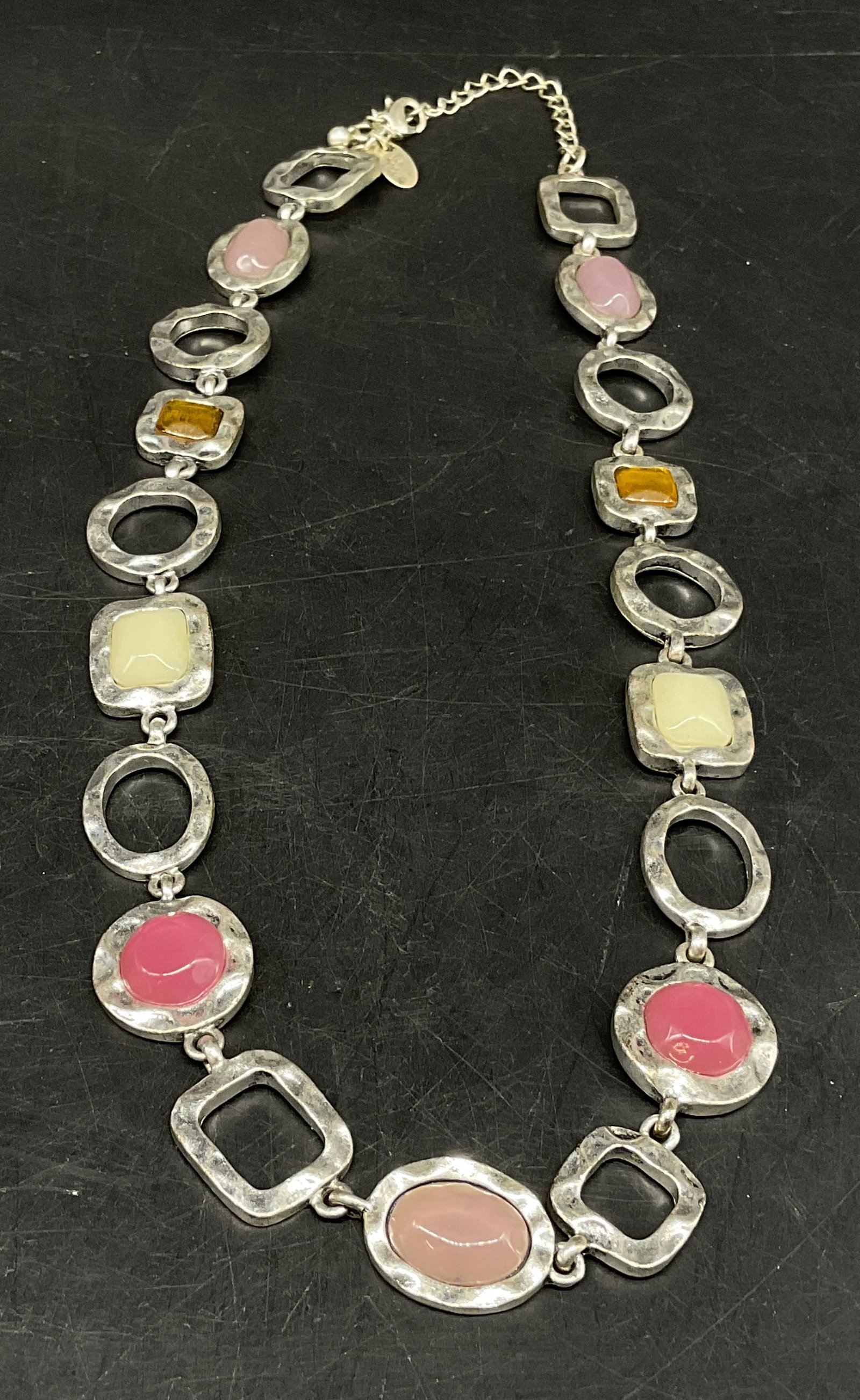 Lia Sophia Silver-Plated Enamel Necklace: Lia Sophia Silver-Plated Necklace. Open Square and Oval Links. Filled Squares and Ovals with Light Pink, Hot Pink, Amber, and White Enamel. Tarnishing Present. Adjustable. Measures app 16in Across Lin