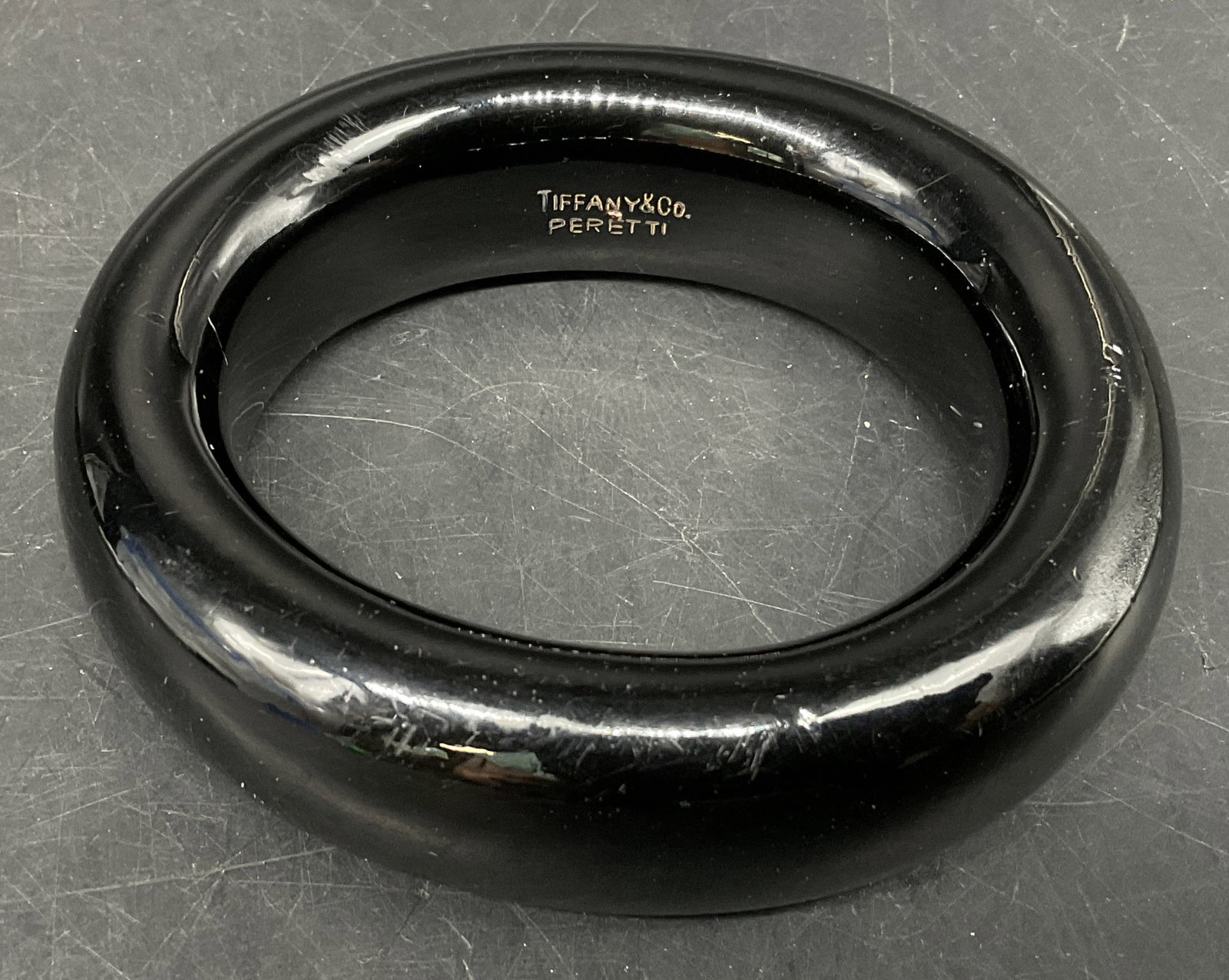 Tiffany & Co Elsa Peretti Lacquer Wood Bangle: Tiffany & Co Elsa Peretti Doughnut Bangle Bracelet. Crafted from Japanese Hardwood Finished with Layers of Glossy Lacquer. Some Scratching. Measures app 3.75in Diam. Tiffany & Co, Elsa Peretti, Doughn