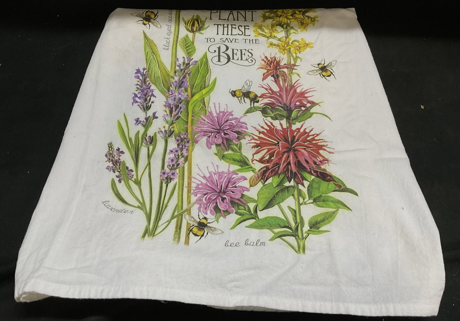Mary Lake Thompson Flour Sack Kitchen Towel: Mary Lake Thompson Flour Sack Kitchen Towel. 100% Cotton. Features Flower with Bees Flying Over Artwork. Text Reads Plant These to Save the Bees. Staining Present. Measures app 28.5in L x 26.5in W. Ma