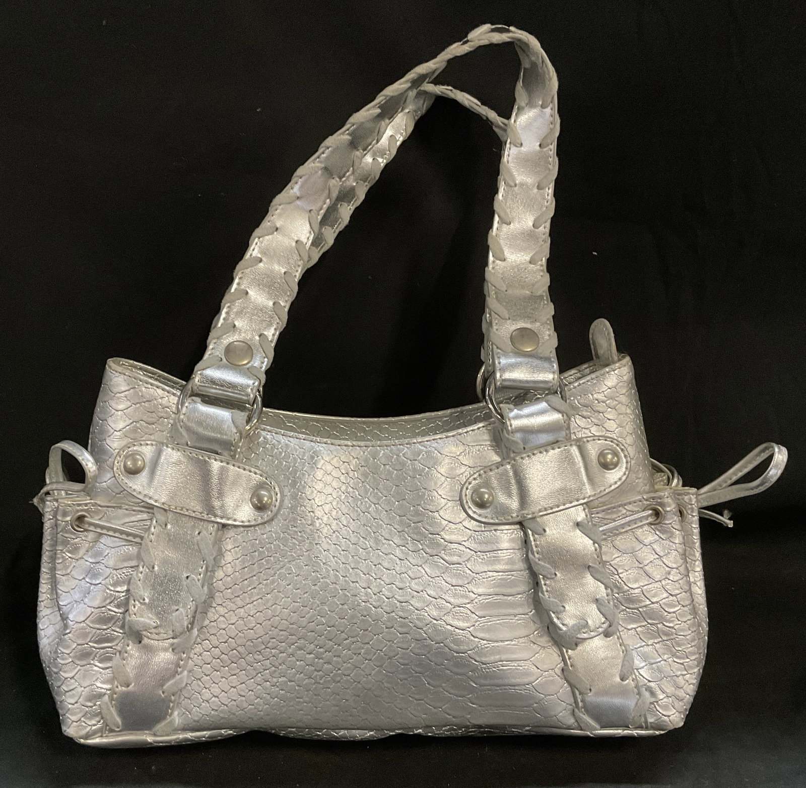 Y2K-Era Metallic Snakeskin Style Satchel: Vintage Y2K-Era Metallic Silver-Toned Snakeskin Leather Style Satchel. Bohemian Hardware and Braided Strap Detailing. Cinching Drawstring Accents on Sides. Some Staining Inside. Measures app 14in H x