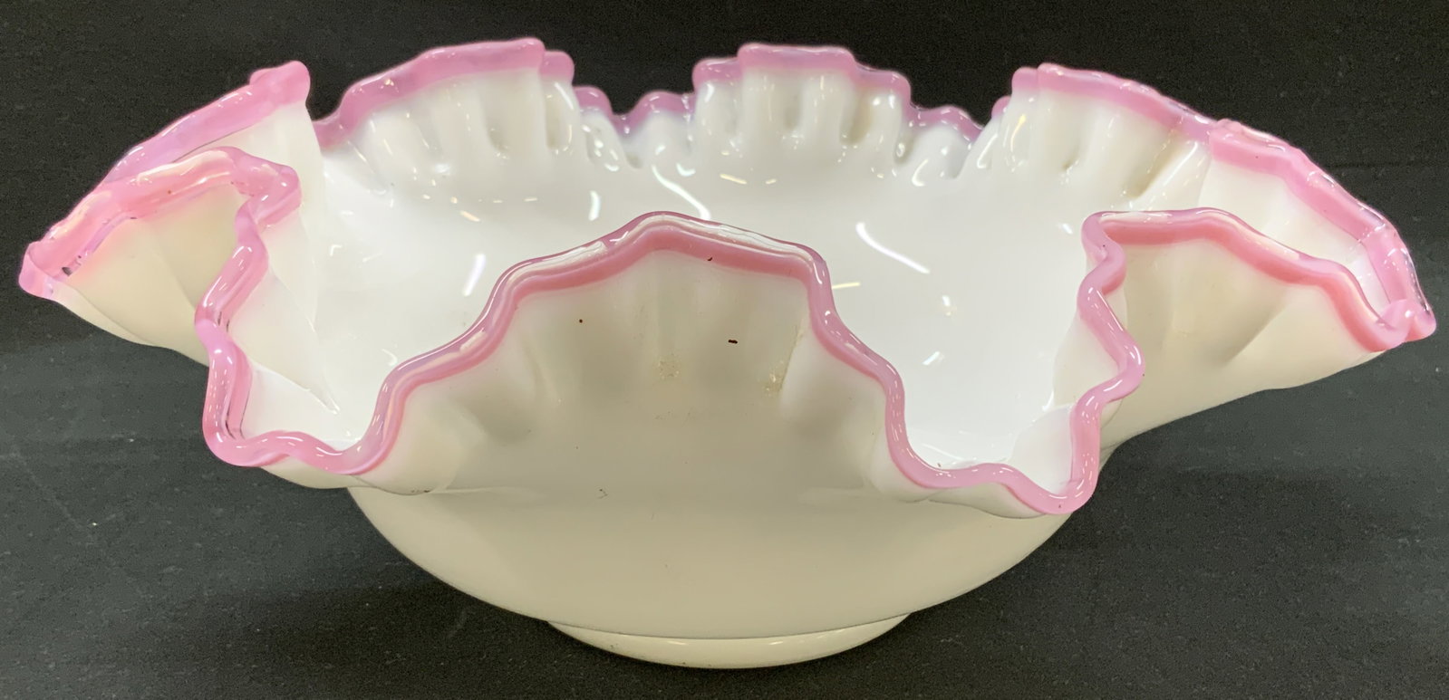 1960 Fenton Apple Blossom Crest Milk Glass Bowl: Vtg 1960 Fenton Apple Blossom Crest Milk Glass Bowl. Art glass console bowl manufactured by Fenton Art Glass Company between 1960 and 1961. Flared rim, double crimped ruffle edge. Semi translucent pas