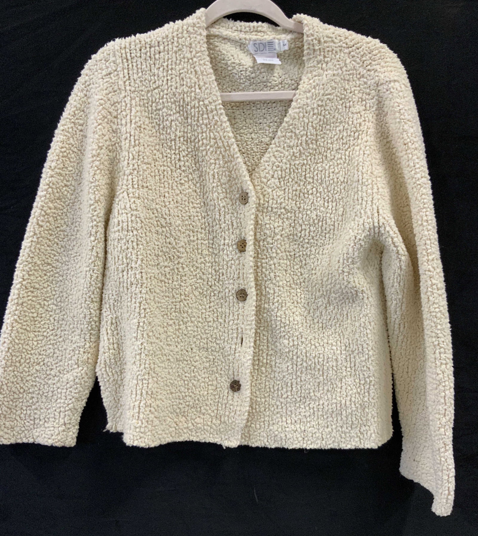 Sdie cream teddy nylon cardigan: SDIE cream teddy cardigan. Made if 100% nylon in a textured teddy knit popcorn stitch. Size medium Features a deep v neck opening accompanied by 5 wood like buttons. The fit is slouchy and relaxed