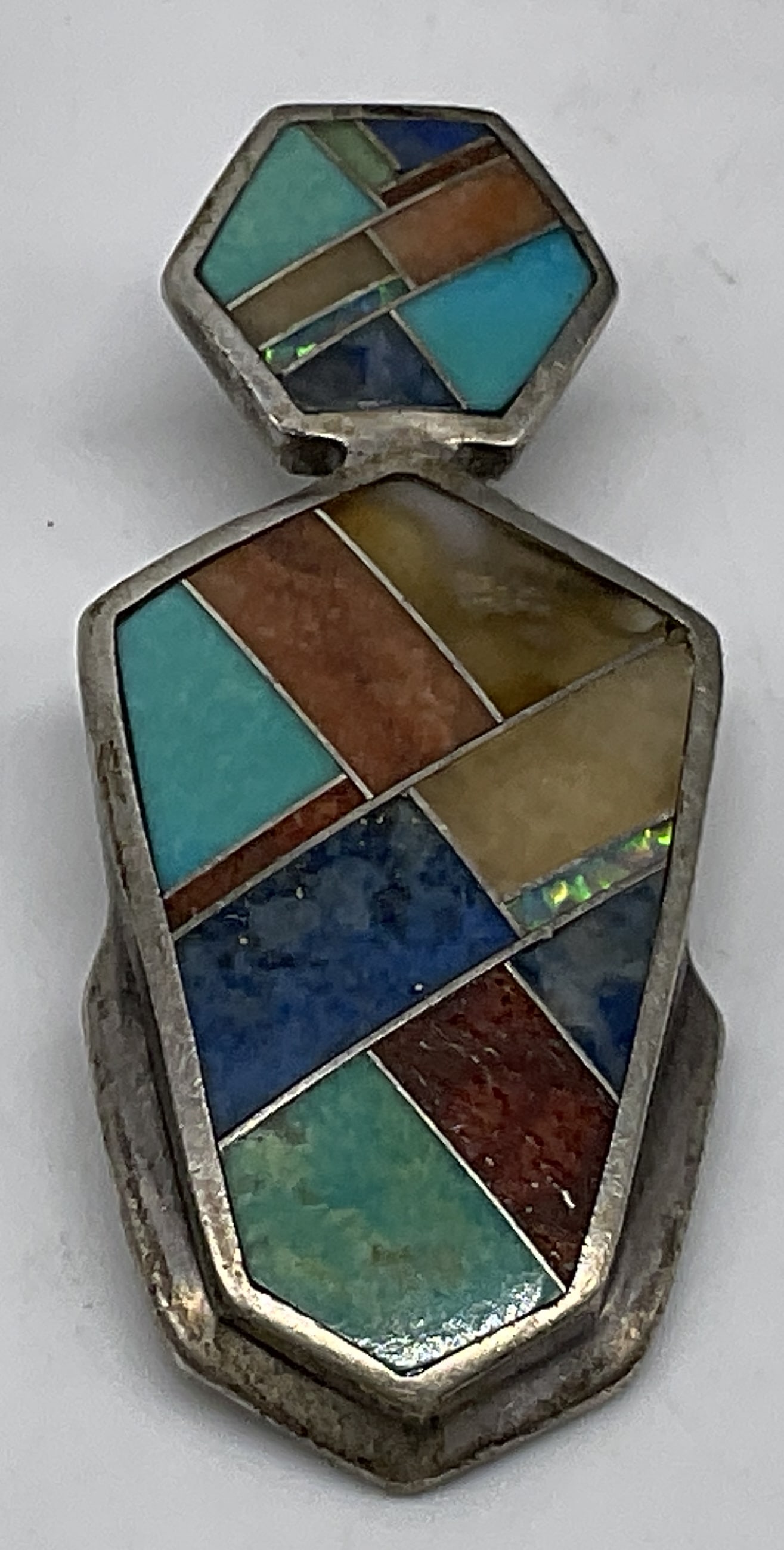 Native American Style Micro-Inlay STERLING Pendant: Native American Style Micro-Inlay Sterling Silver Pendant. Geometric layout similar to Zuni or Navajo master lapidary work. semi-precious gemstones and organic materials. Marked Sterling with Makers M
