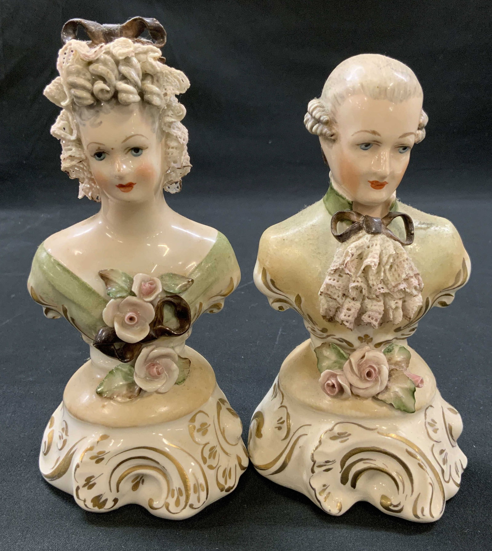 Vtg c.1940 Corde Porcelain Victorian Figurines: Vintage pair of mid century porcelain Victorian style bust figurines. Woman and Man. Woman in powdered hairstyle with brown hair bow, green dress. Man in swept back wig with green coat and brown bow
