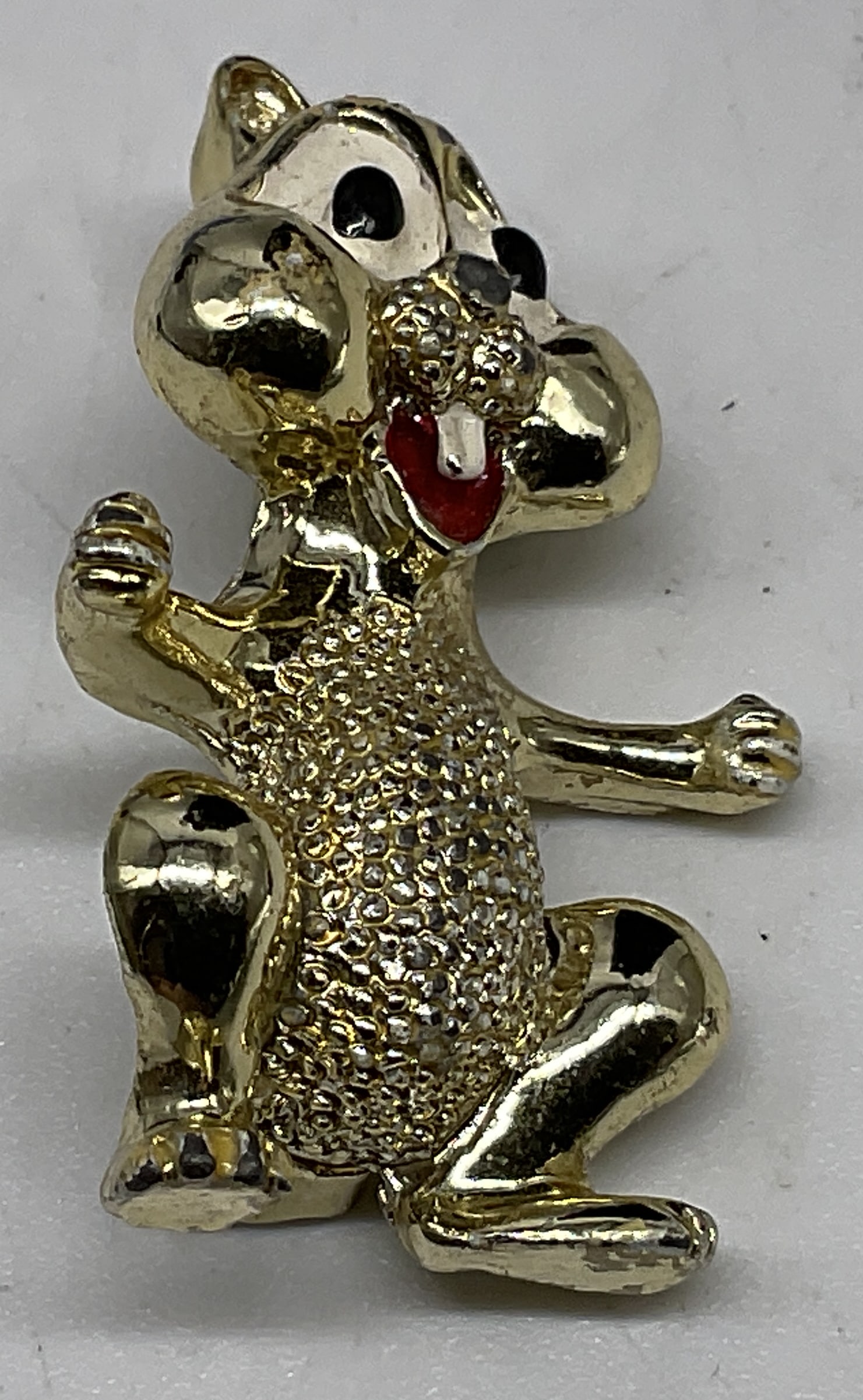 VTG 60s Gerrys Cartoon Chipmunk Scatter Pin: Vintage 1960s Gerrys Cartoon Chipmunk Scatter Pin. Gold-Toned with textured nugget pattern. Red laughing mouth. Condition consistent with age and exposure. Measures approx in 1.25 in H x 1 in W.