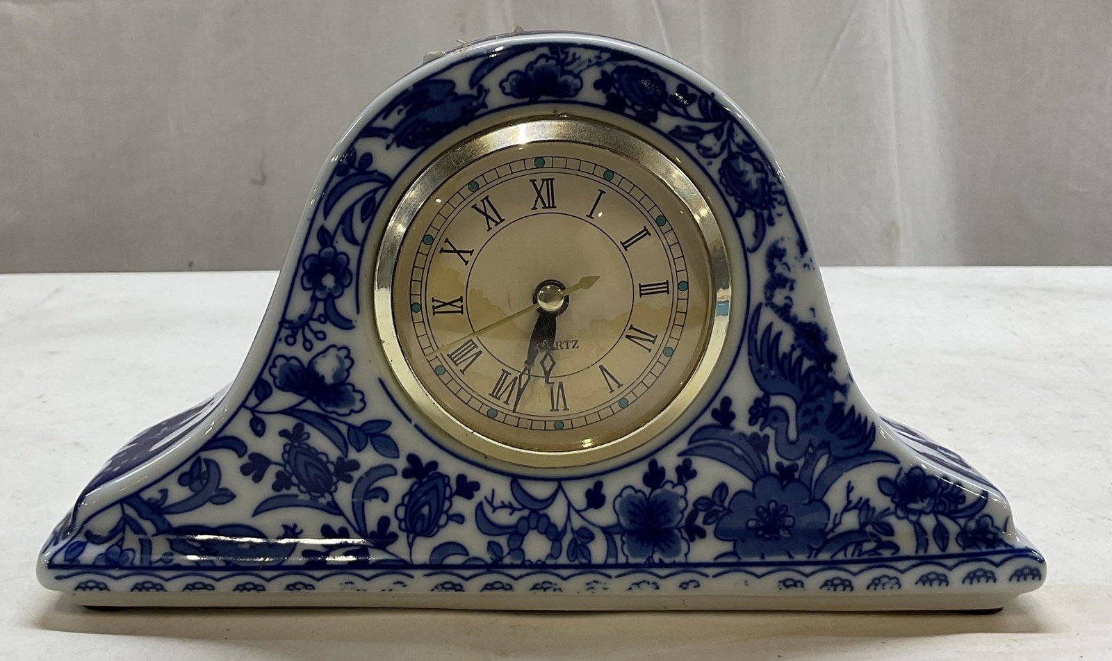 Vintage Blue & White Porcelain Mantle Clock: Vintage blue and white porcelain mantle clock. Rectangular base with arched top. Blue and white floral and bird motifs. Roman numerals. Measures approx 3 x 9.5 x 5.5 inches. Not tested for function, s