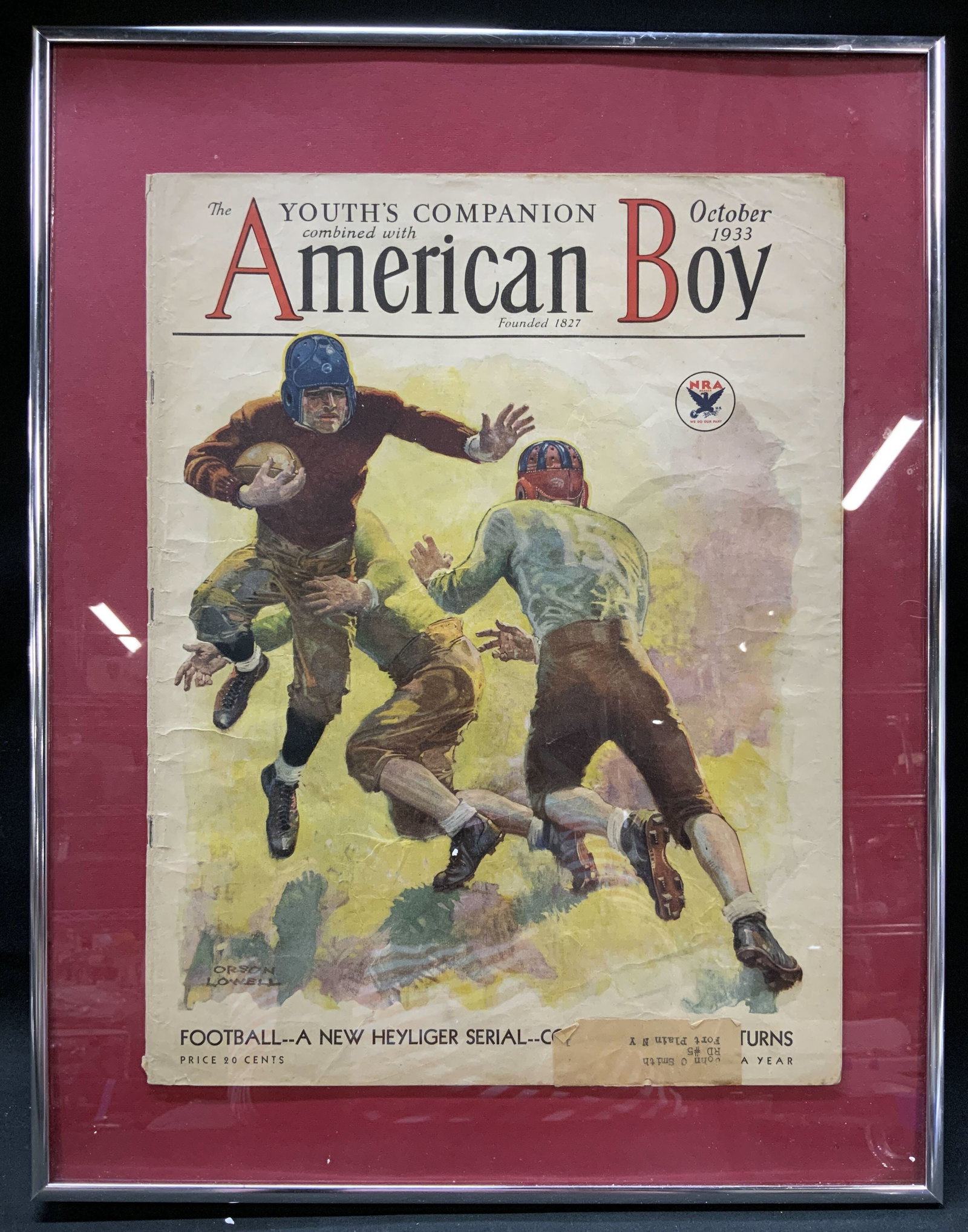 1933 American Boy Magazine Football Cover, Framed: Original Vintage 1933 cover of The Youths Companion combined with American Boy magazine from the October 1933 issue. Football illustration by American Artist and illustrator Orson Lowell. Displays a b