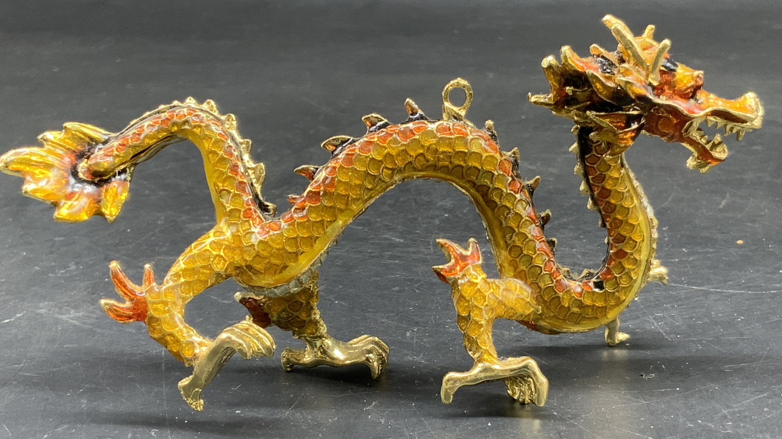 Gold tone enamel crystal Dragon Figural: Chinese dragon figural designed with an elongated winding body, featuring detailed golden scales coated with orange and yellow enamel gradient, translucent glazed accents, and colorful crystals, the d