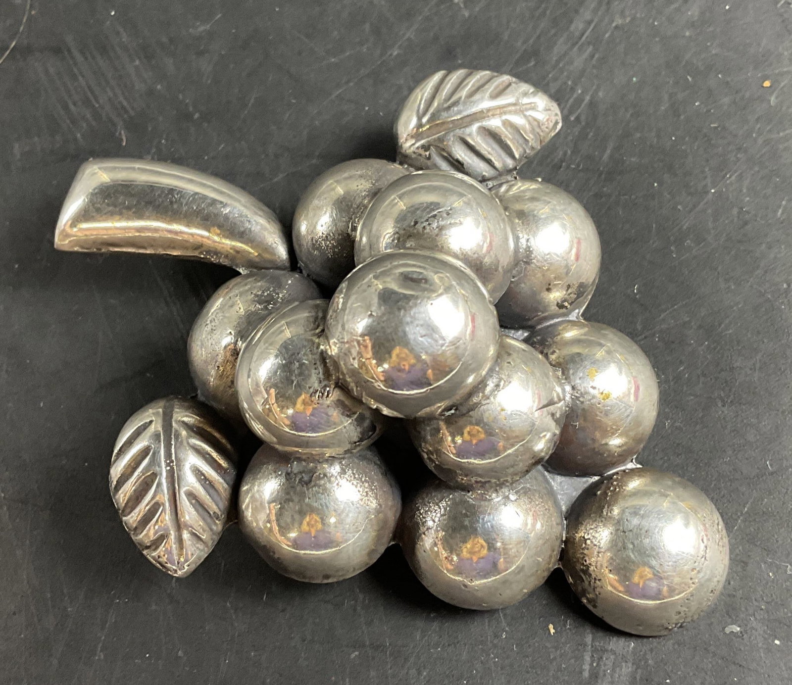 Mexican Sterling Silver Grape Cluster Brooch: Vintage Mexican Sterling Silver Grape cluster brooch features a dimensional 3d design complete with individual puffy silver spheres as grapes and detailed leaf accents, measures 3 inches by 2 inches,