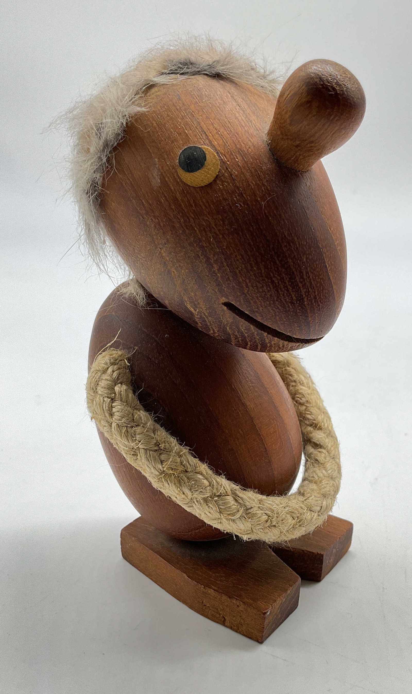 Hans Bolling Orskok Denmark Sgn Figural: MCM Optimist Wooden Figure designed by Hans Bolling for Orskov & Co in Denmark in the 1950s, crafted from carved teak wood with a whimsical fur trimmed head and a coiled rope accent, signed and